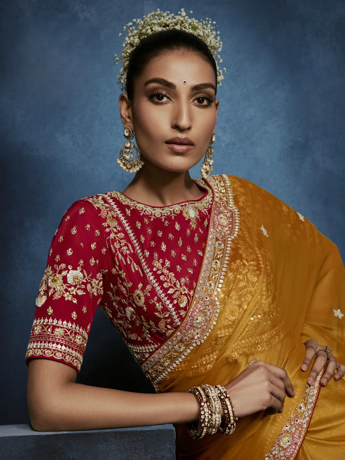 Tarani designer mustard saree front pose with detailed maroon blouse and festive styling