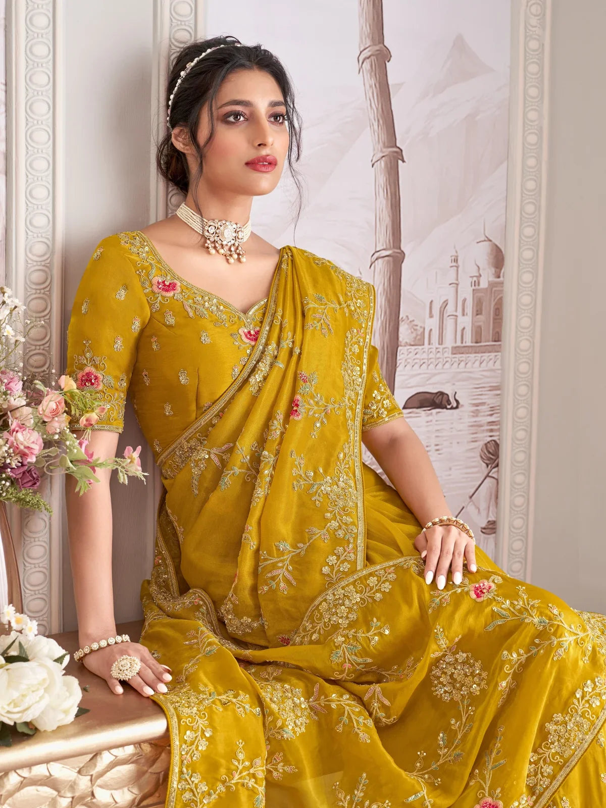 Tarani mustard fancy saree with blouse and jewelry upper body view