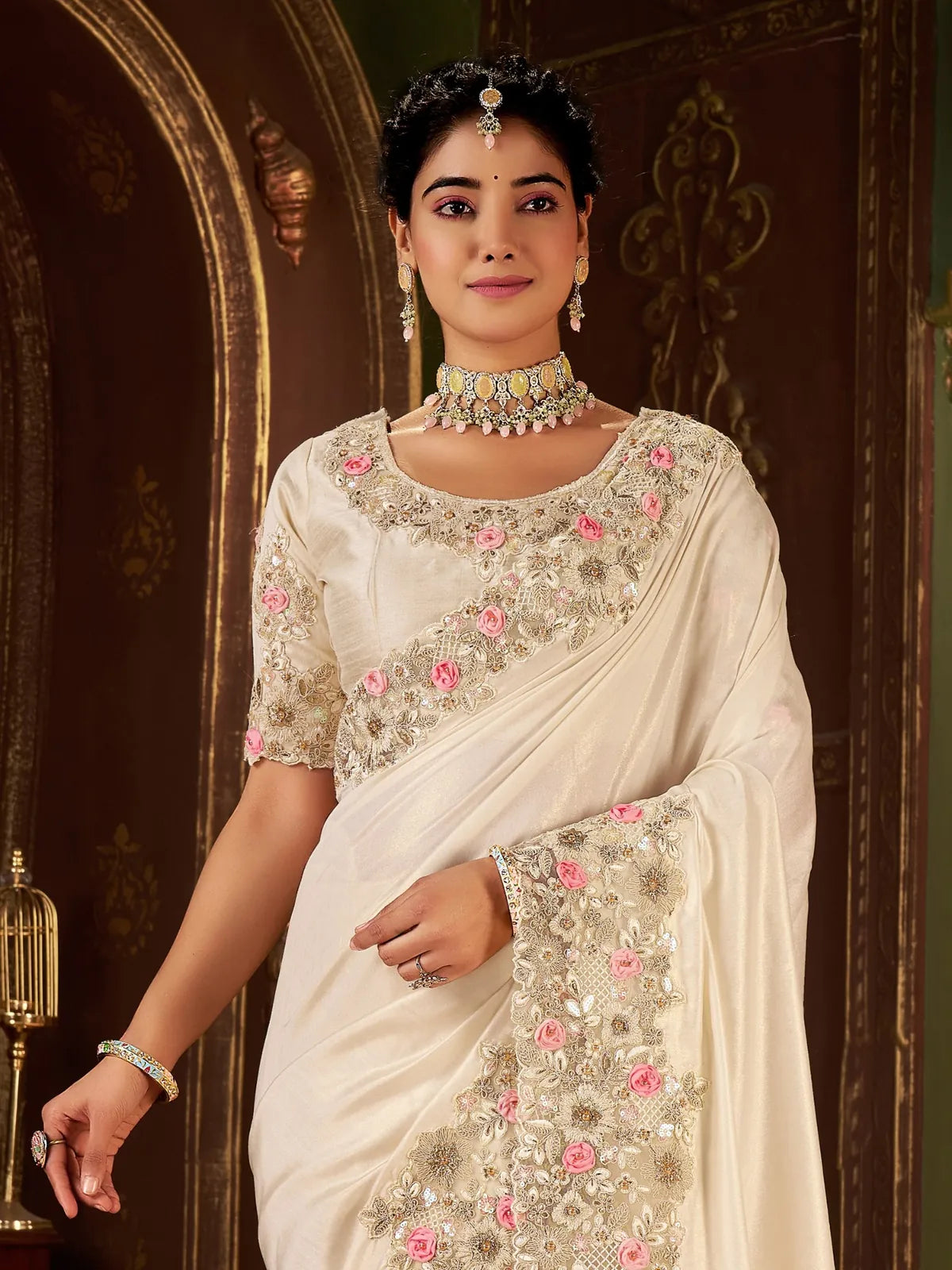 Tarani close up of fancy saree blouse with intricate floral embroidery and soft sheen