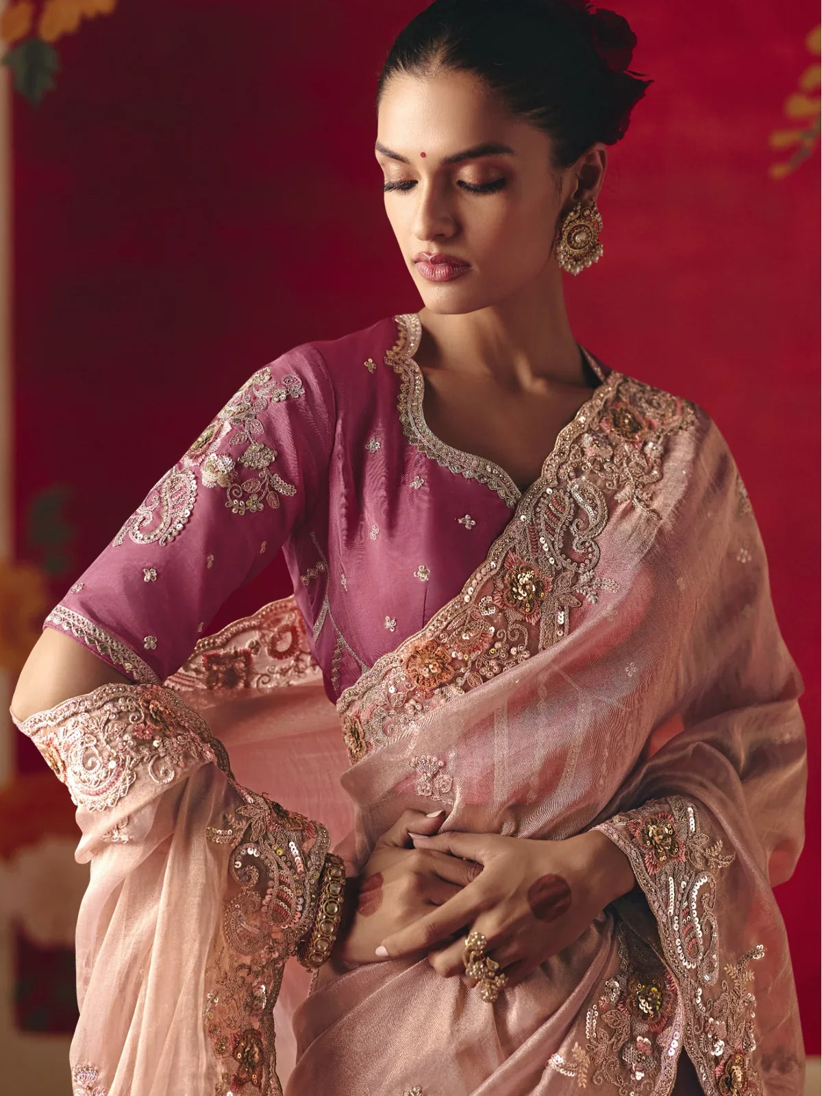 Tarani upper-body view of peach saree with embroidered maroon blouse