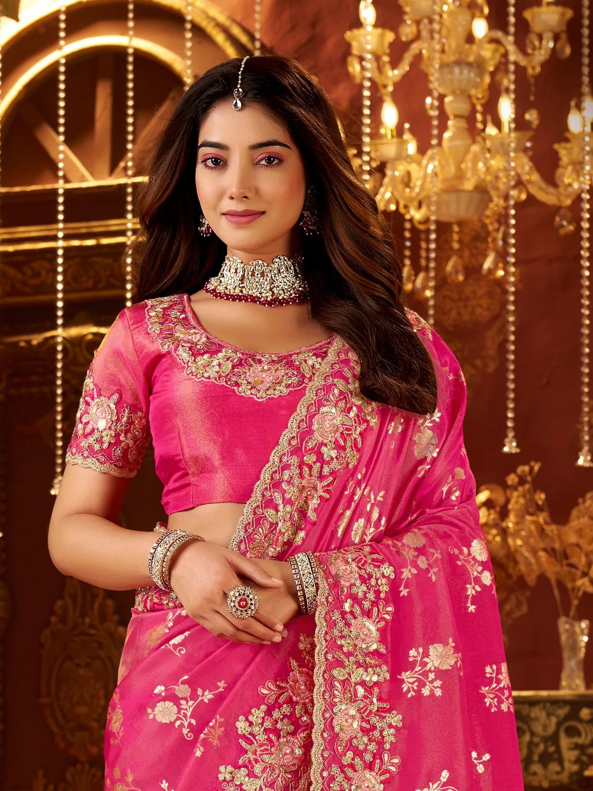 Tarani embroidered blouse and zari detailing pink saree for festive or wedding wear - upper body view