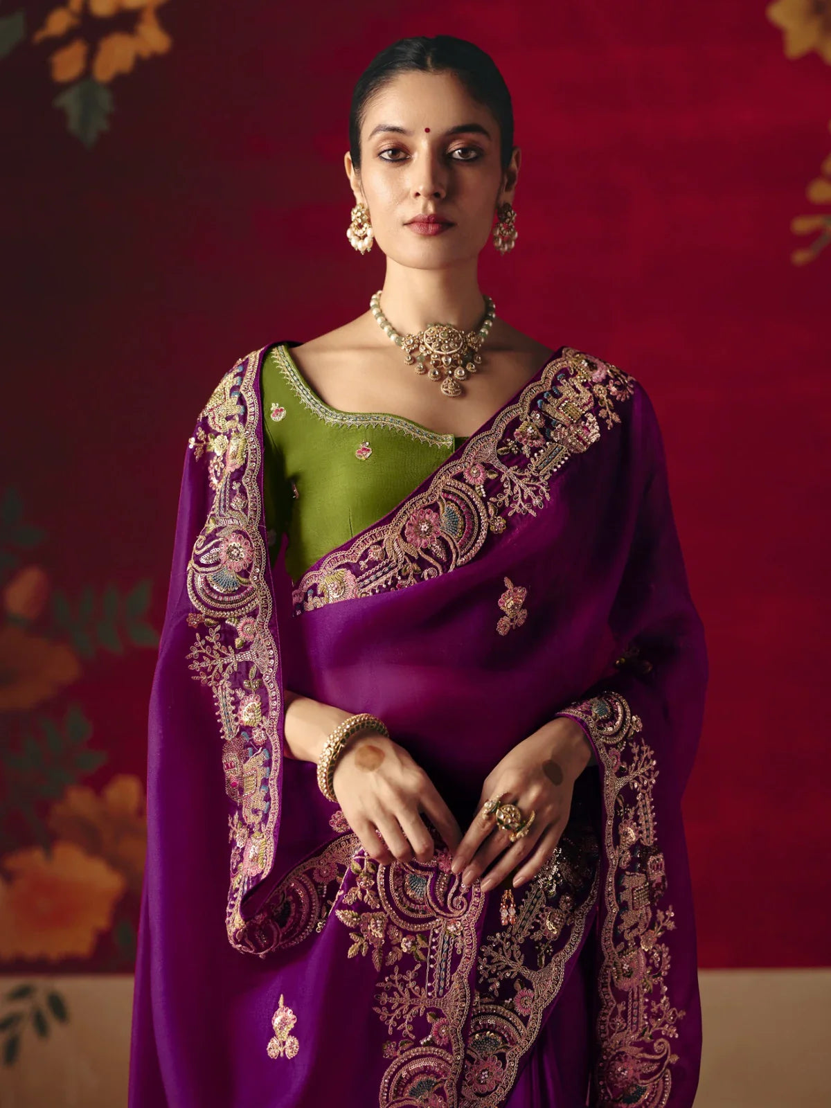 Tarani fancy purple saree close-up showing embroidered pallu and green designer blouse