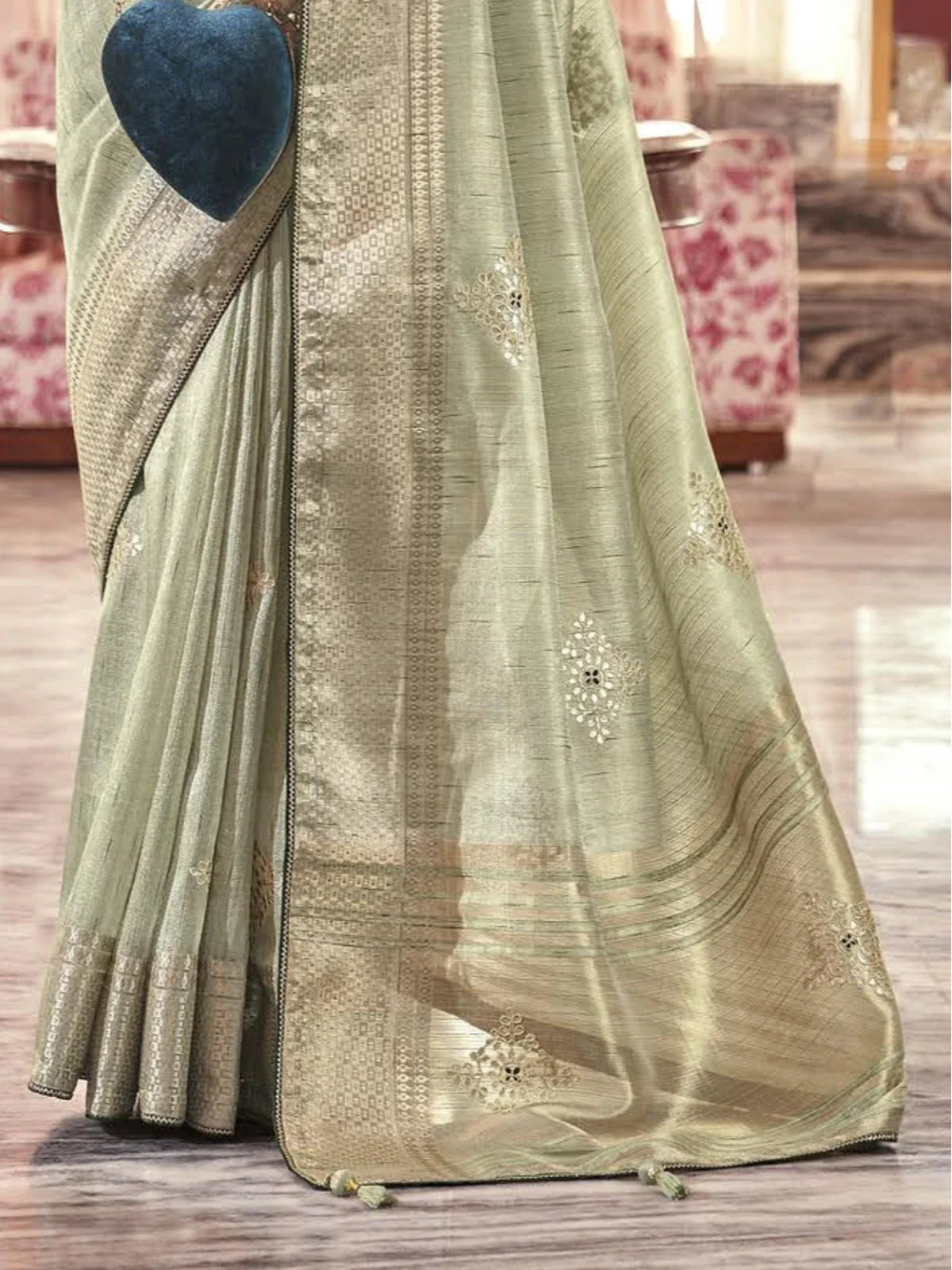 Tarani fancy sage green saree closeup view showing fine woven texture and border detailing