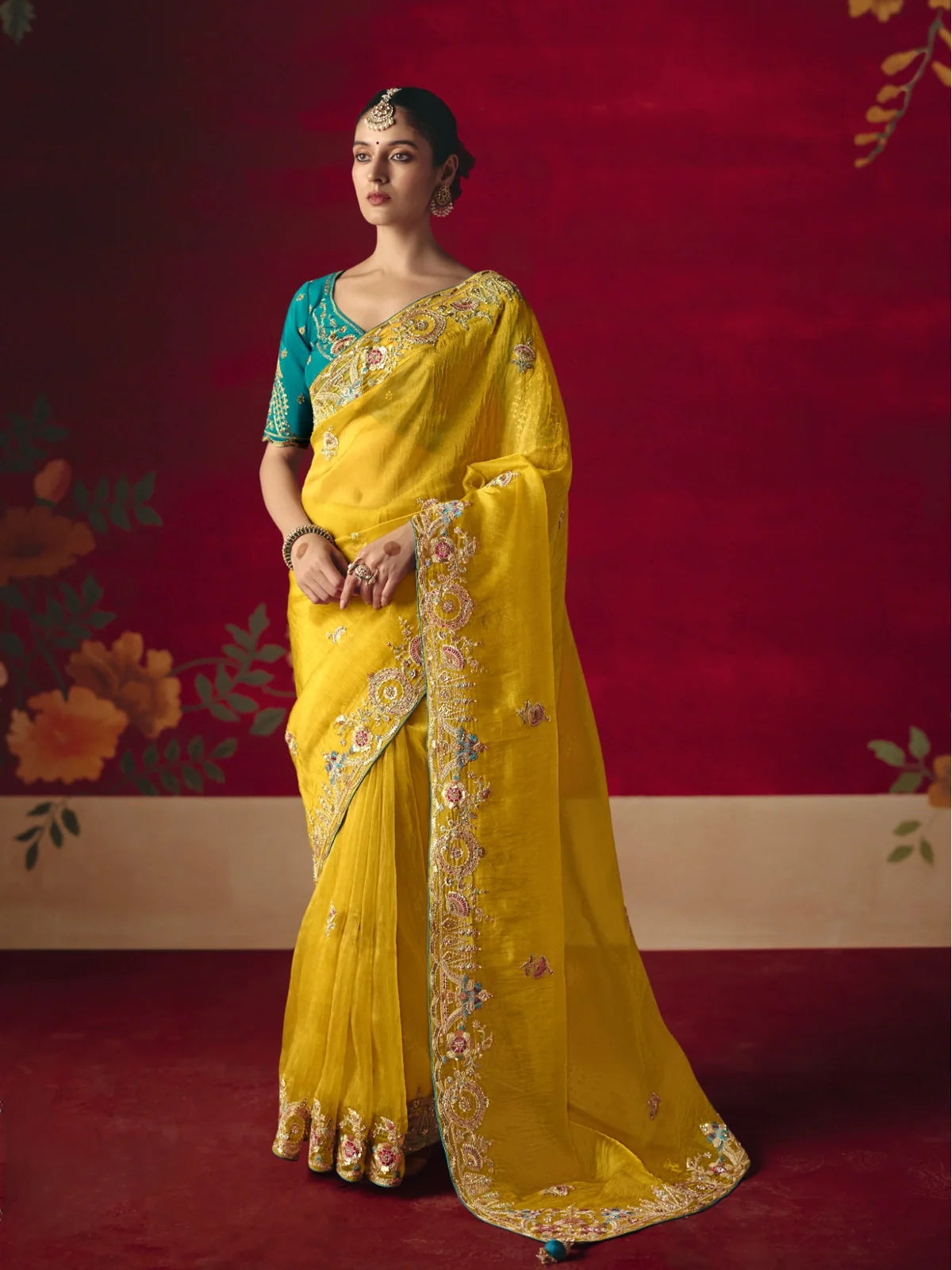 Tarani yellow fancy saree full view with embroidered border and festive styling