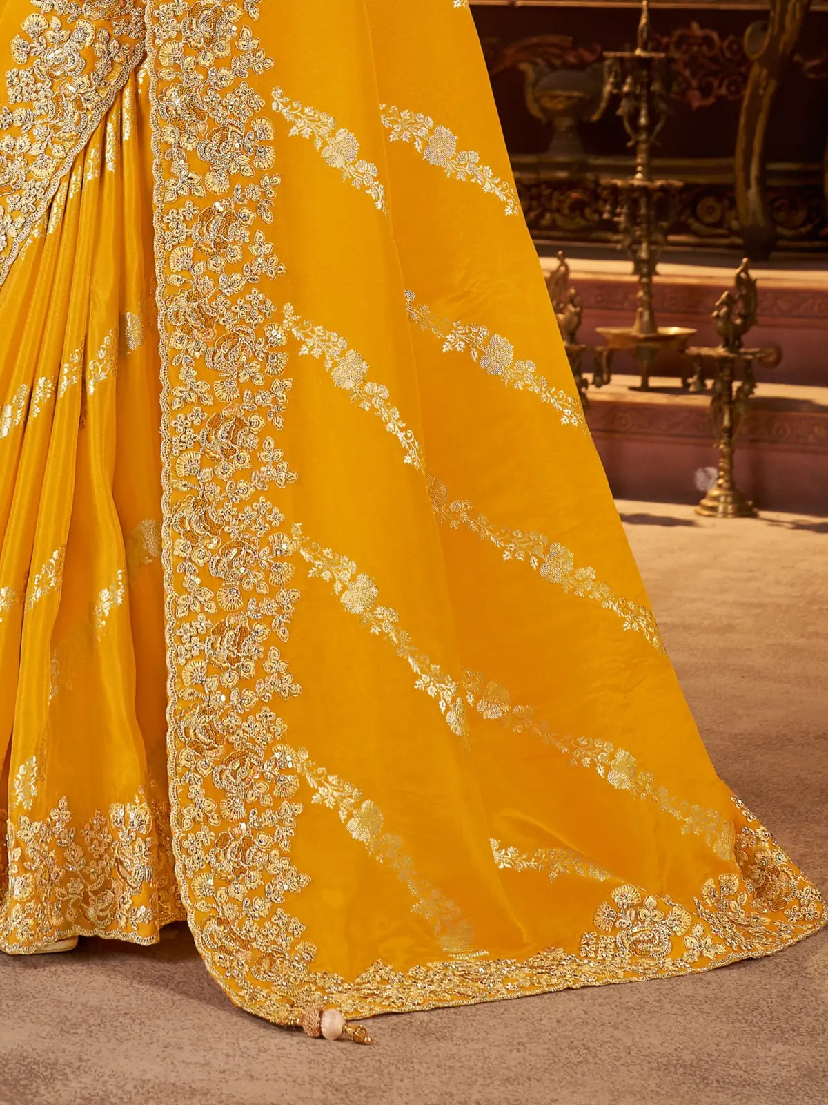 Tarani yellow saree with rich zari embroidery and designer blouse shown in pallu view