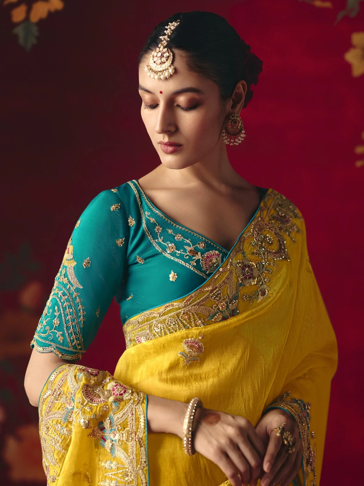 Tarani yellow saree closeup of blouse and neckline with embroidery details