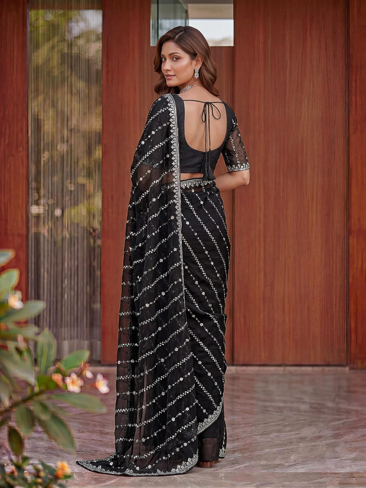 Tarani black Fandy Satin saree back view blouse design with embroidered pallu