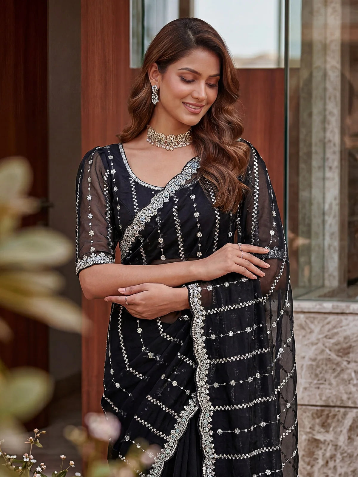 Tarani black Fandy Satin saree upper body view with sequins embroidery blouse detailing