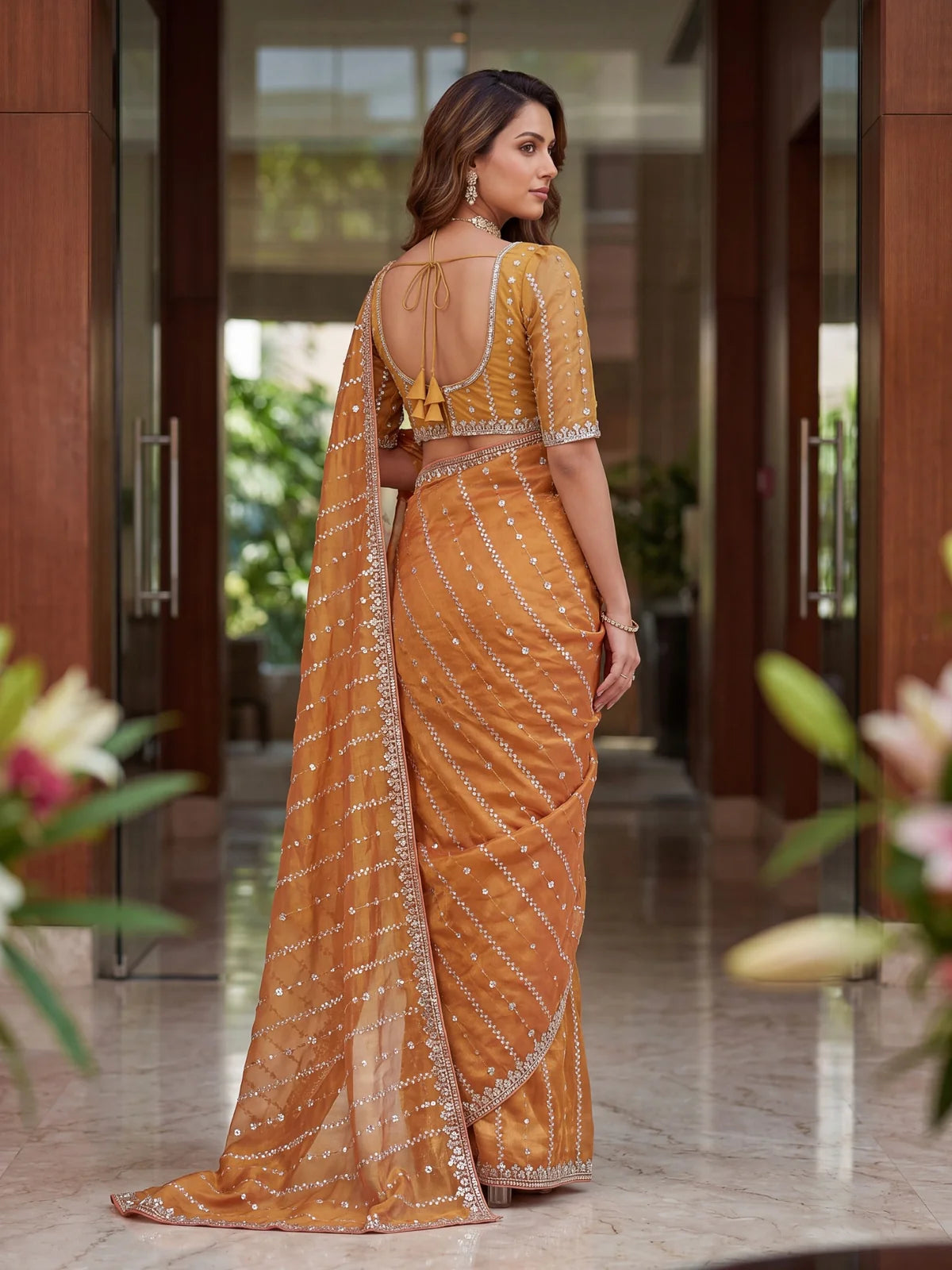 Tarani golden Fandy Satin saree back view showing blouse design and pallu fall