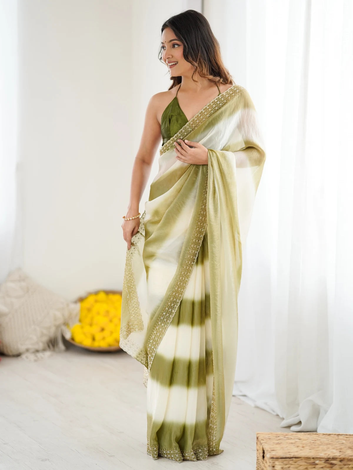 Tarani Aradhita green Fandy Satin saree side view with shimmering border
