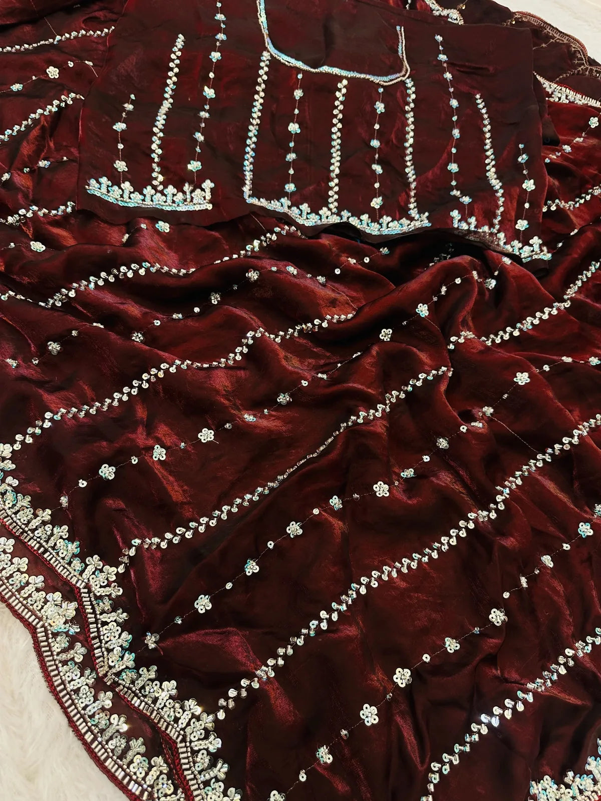 Tarani Devika maroon Fandy Satin saree closeup of beads and sequins embroidery work fabric
