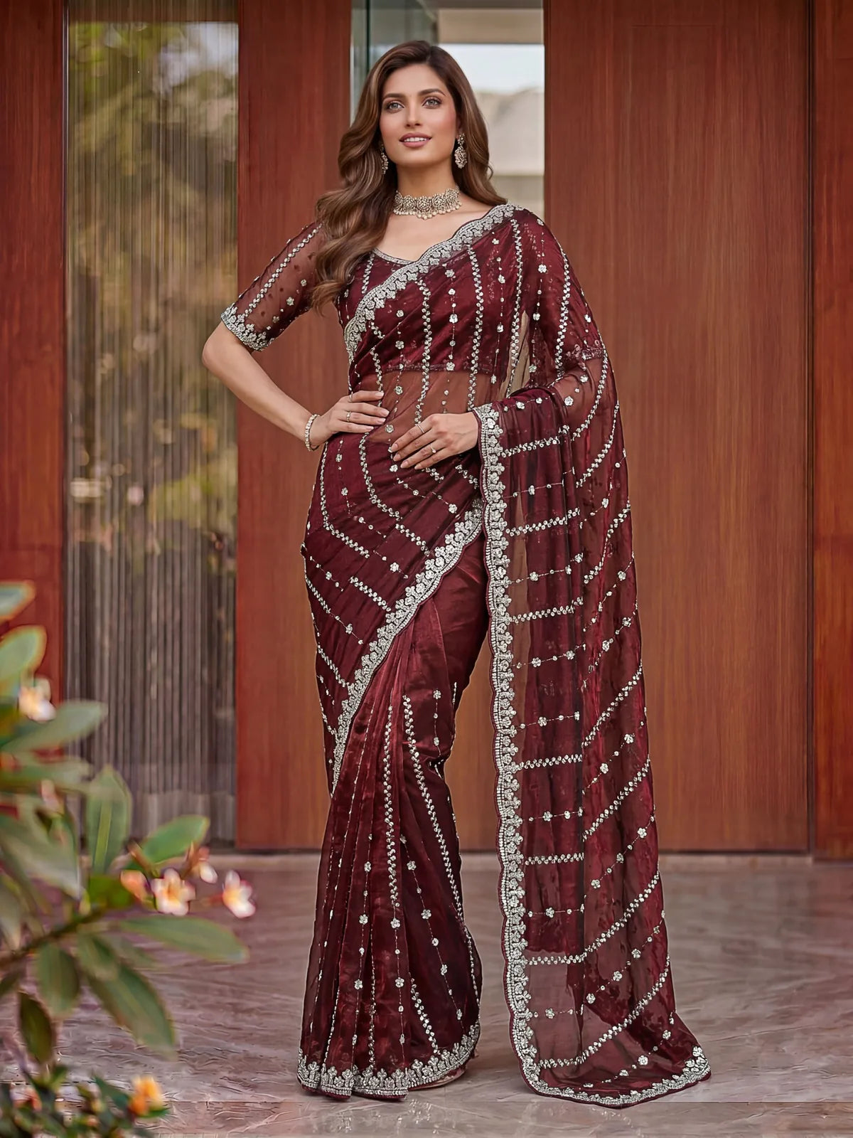 Tarani Devika maroon Fandy Satin saree front pose showcasing embroidered drape and designer blouse