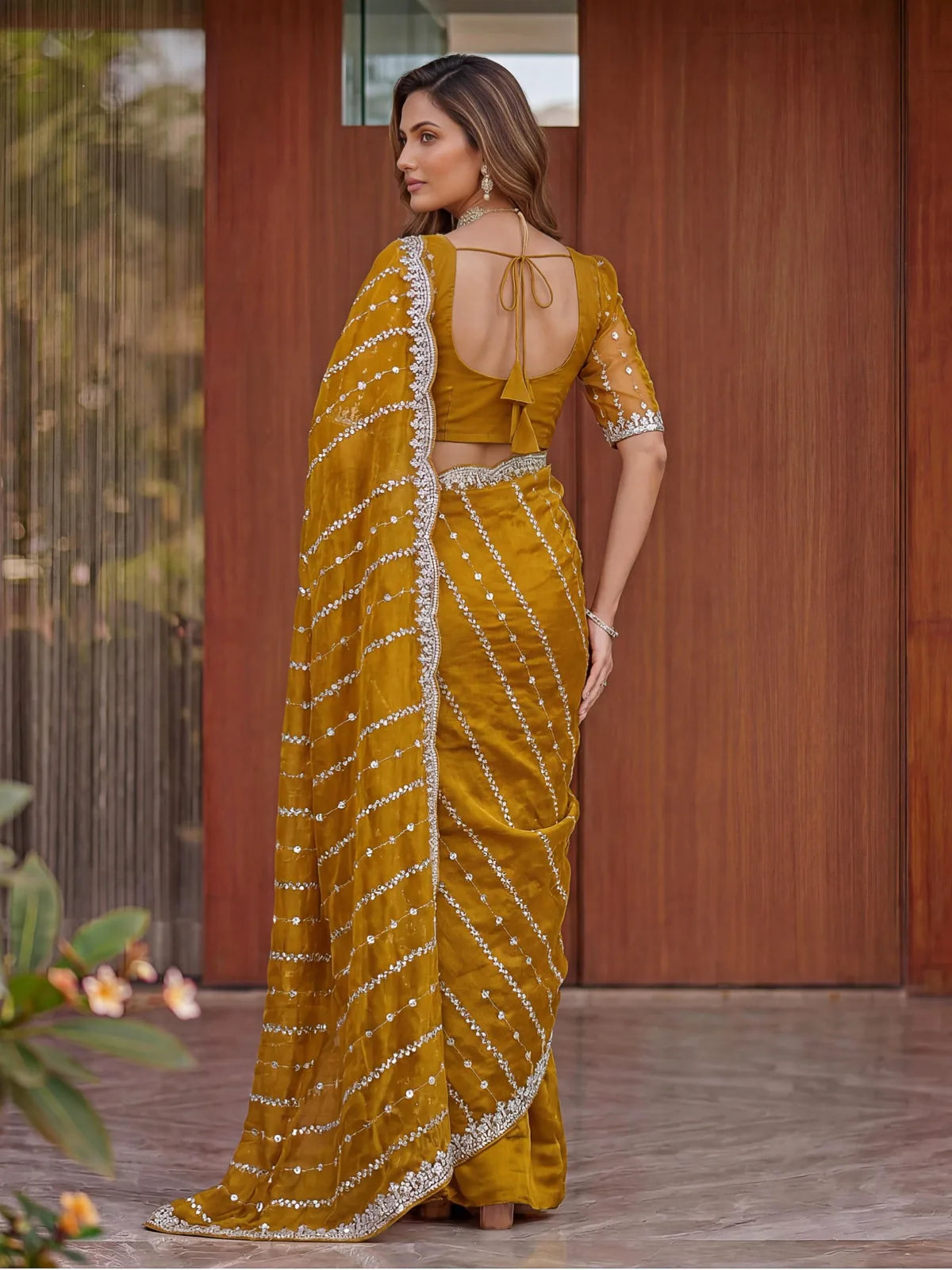Tarani mustard Fandy Satin saree back view showing blouse back design and embroidery