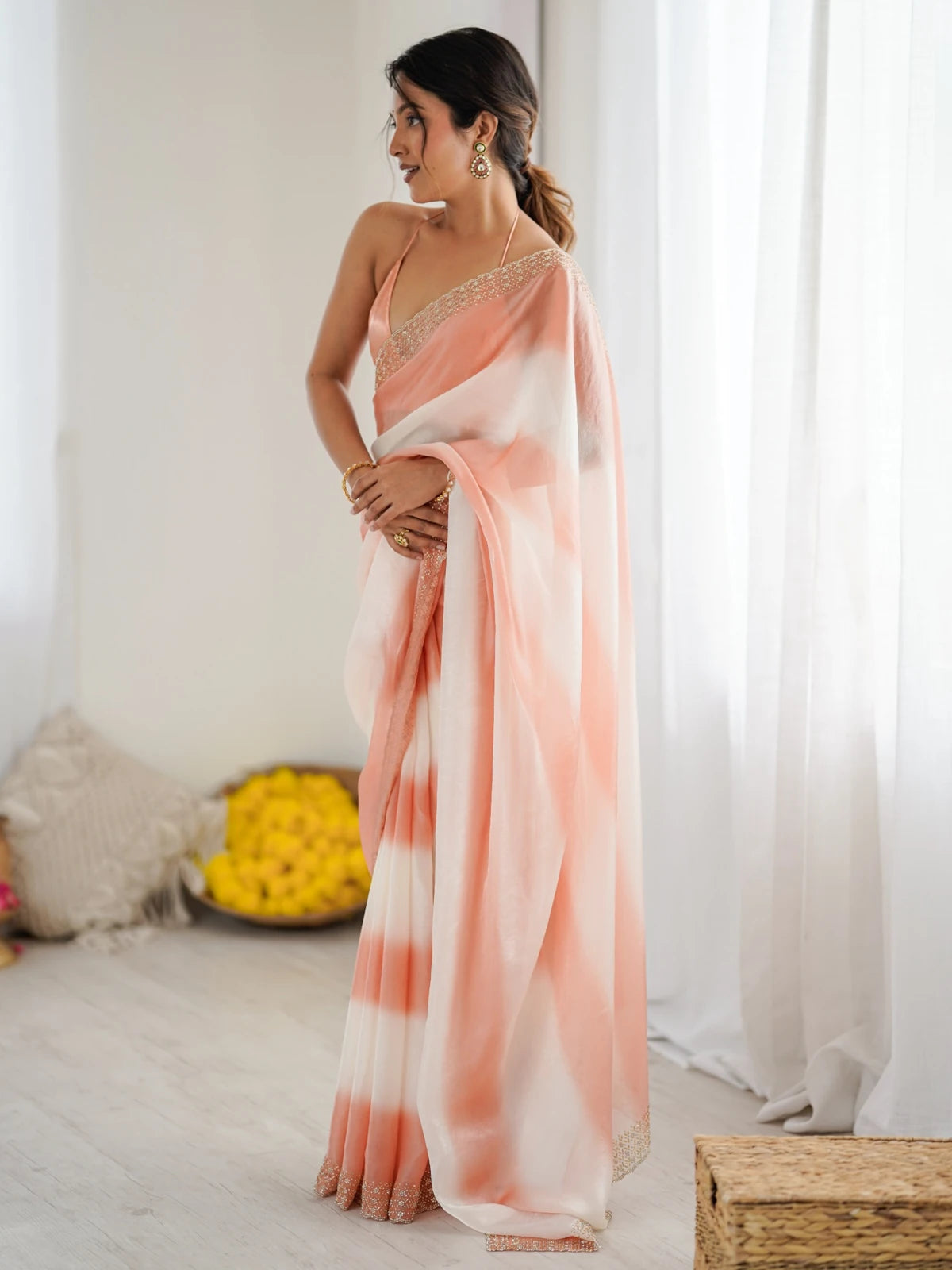 Tarani Drishya peach Fandy Satin saree back view with elegant flowing drape