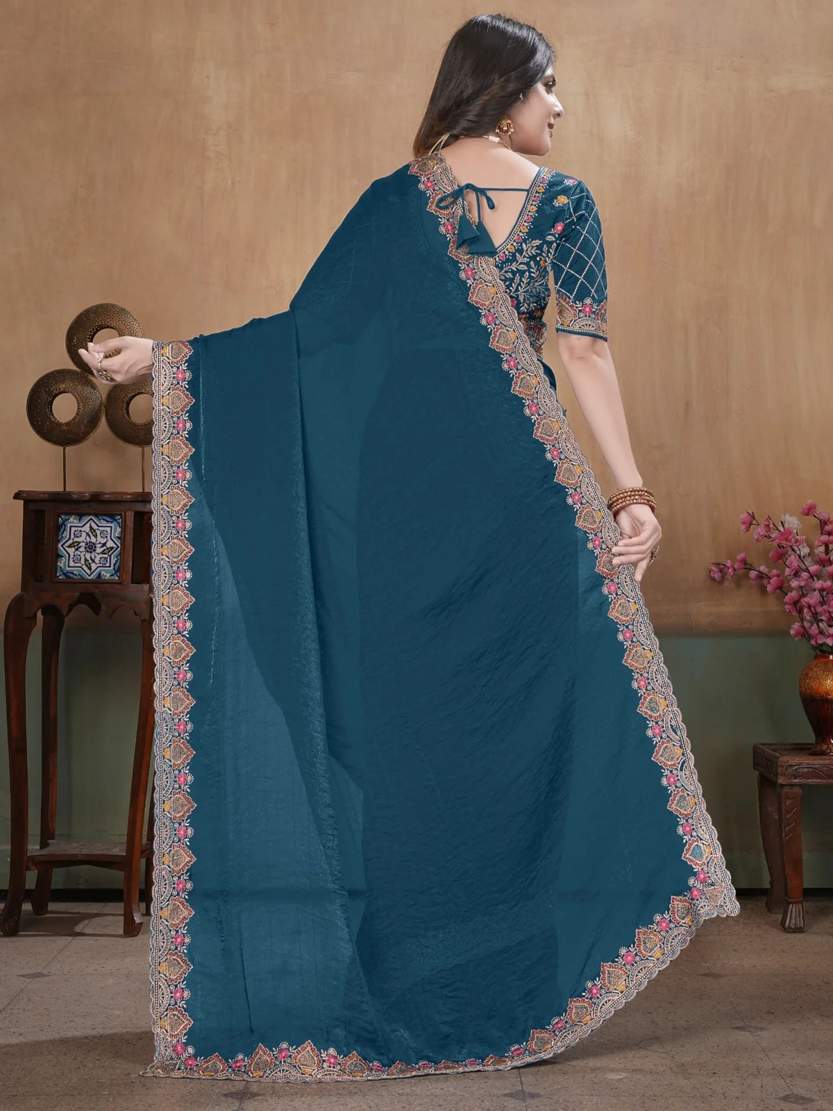 Tarani teal Fandy Satin embroidered saree back view with detailed pallu