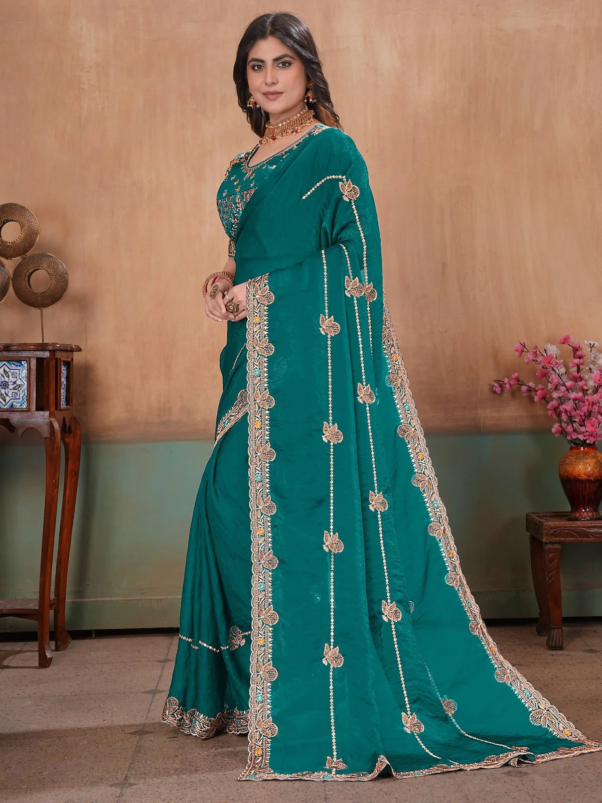 Tarani teal Fandy Satin saree side view showcasing flowing pallu and Swarovski embroidery