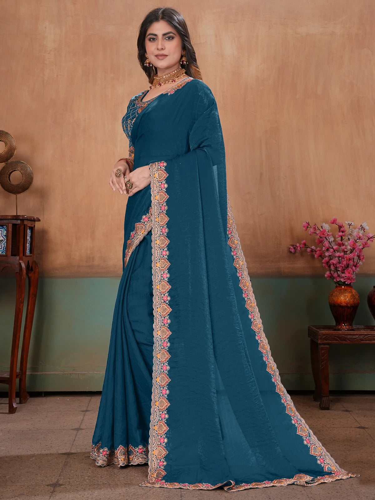 Tarani teal Fandy Satin embroidered saree elegant side view