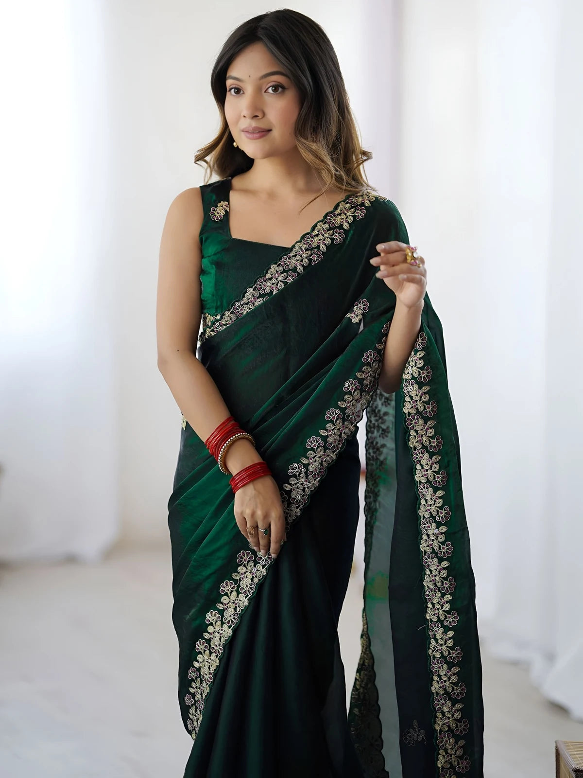 Tarani green Fandy Satin Silk saree upper body view with embroidered border and designer blouse