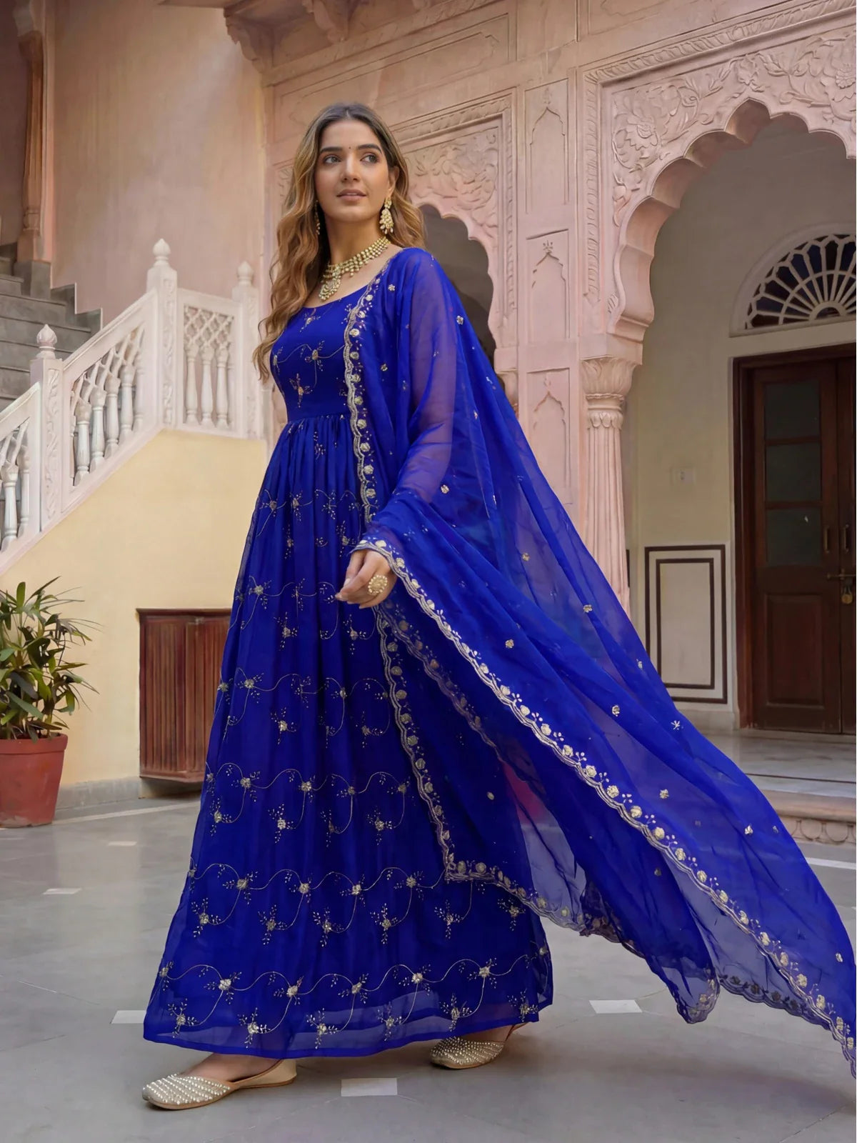 Tarani full-length view of elegant blue Fandy silk dress with dupatta and traditional gold detailing