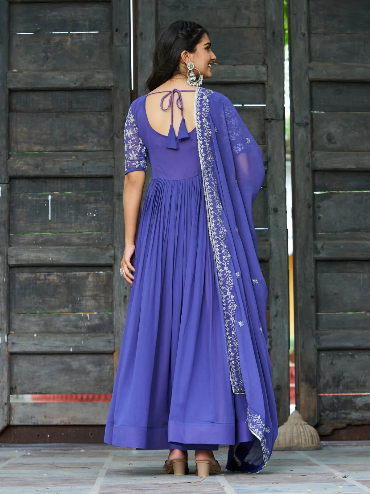 Tarani purple faux blooming gown back view with tie-up design and dupatta fall embroidery details