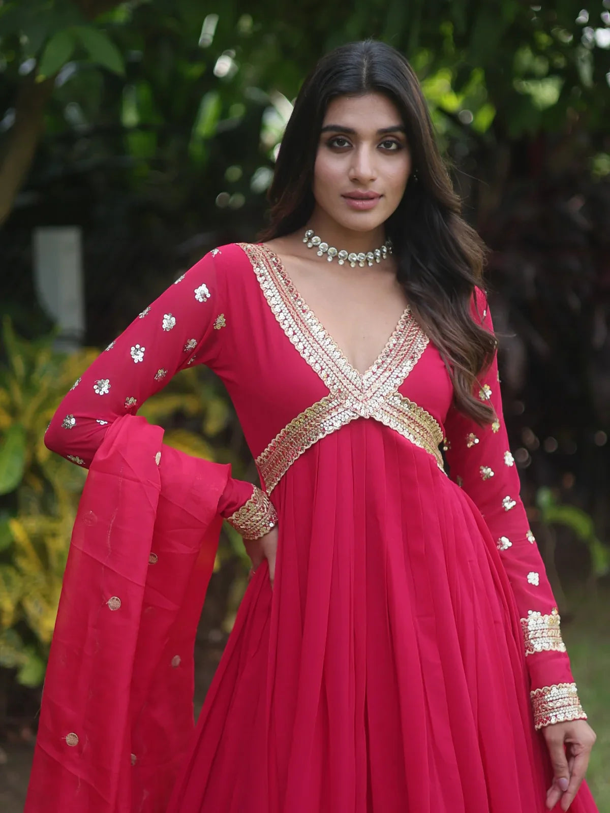 Tarani red faux blooming gown upper body showing neckline and embroidery detailing