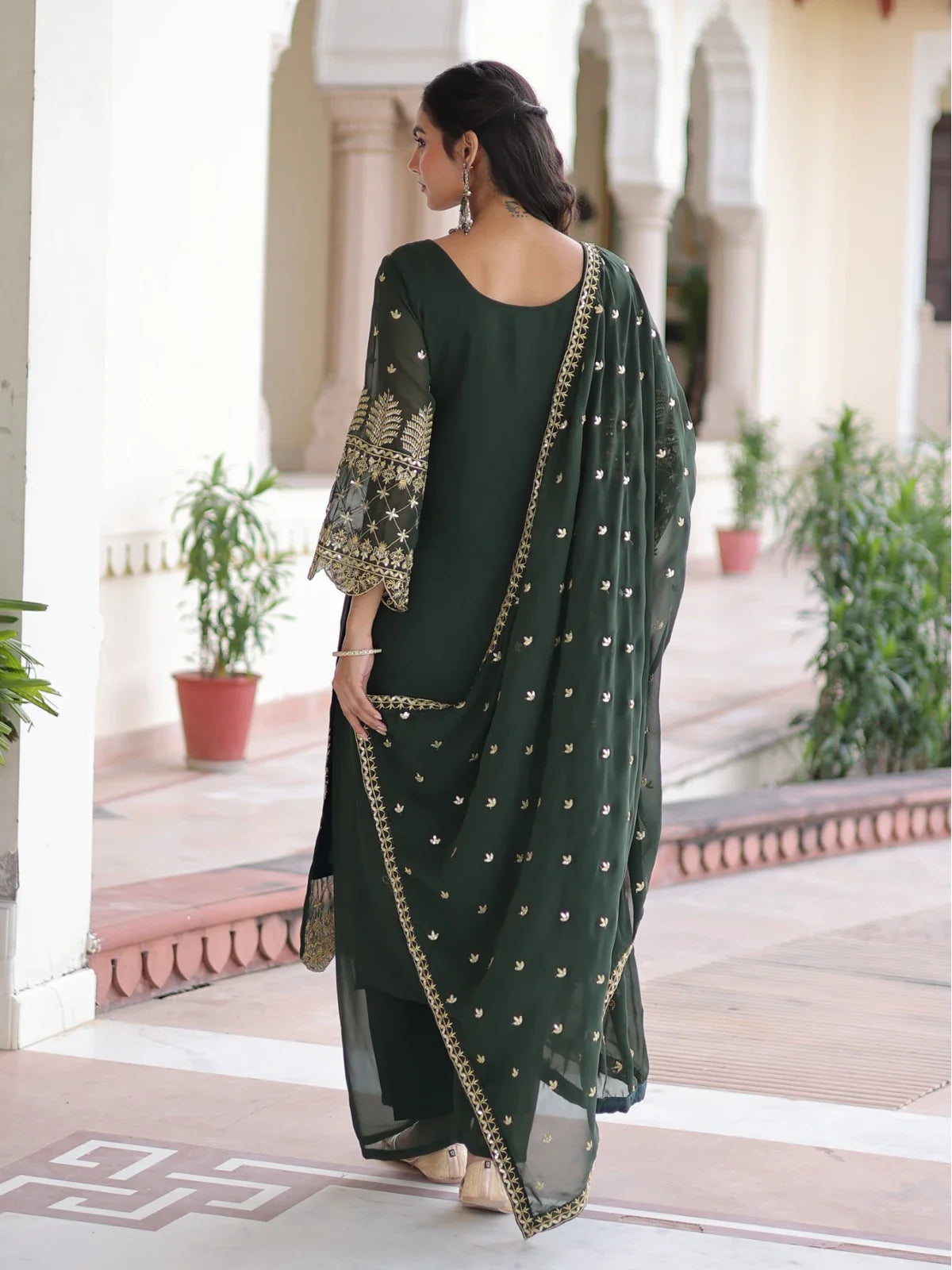Back side view of Tarani green dress with embroidered dupatta and soft flow silhouette