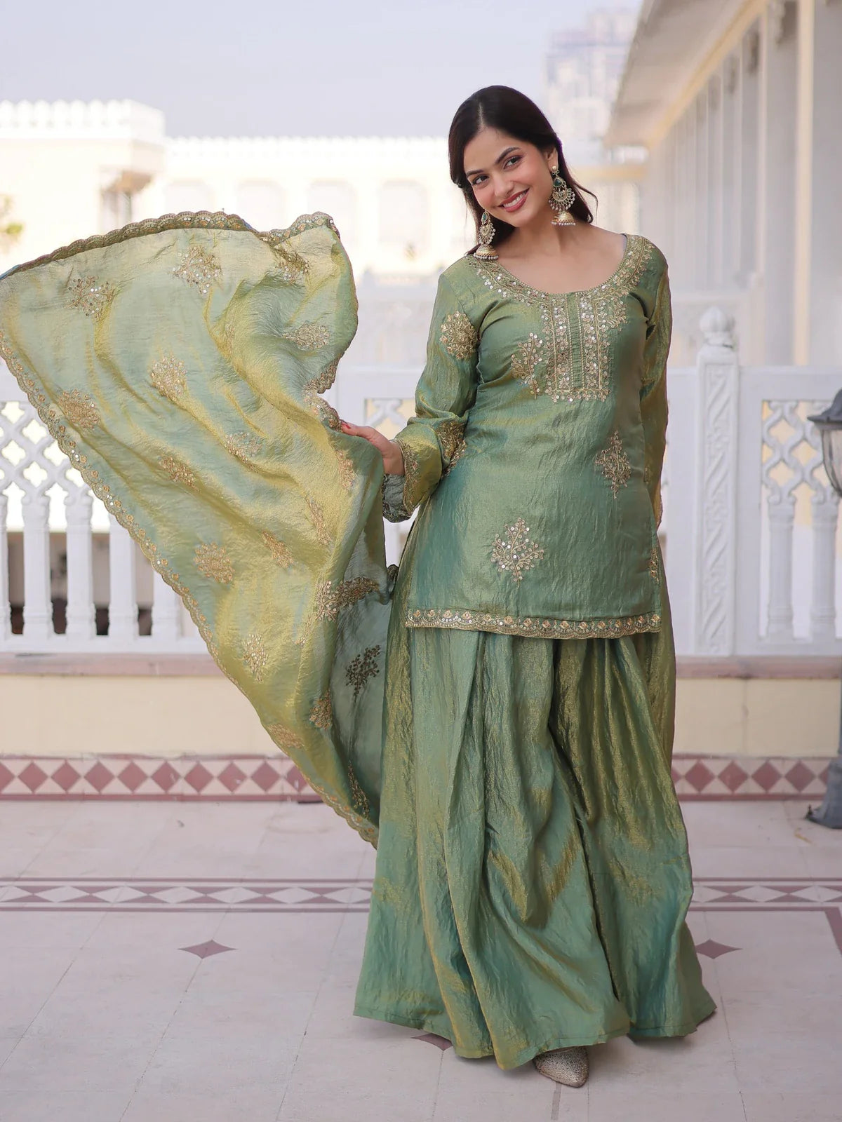 Tarani premium green fendi crush dress set with full view showing zari embroidery and flowing sharara