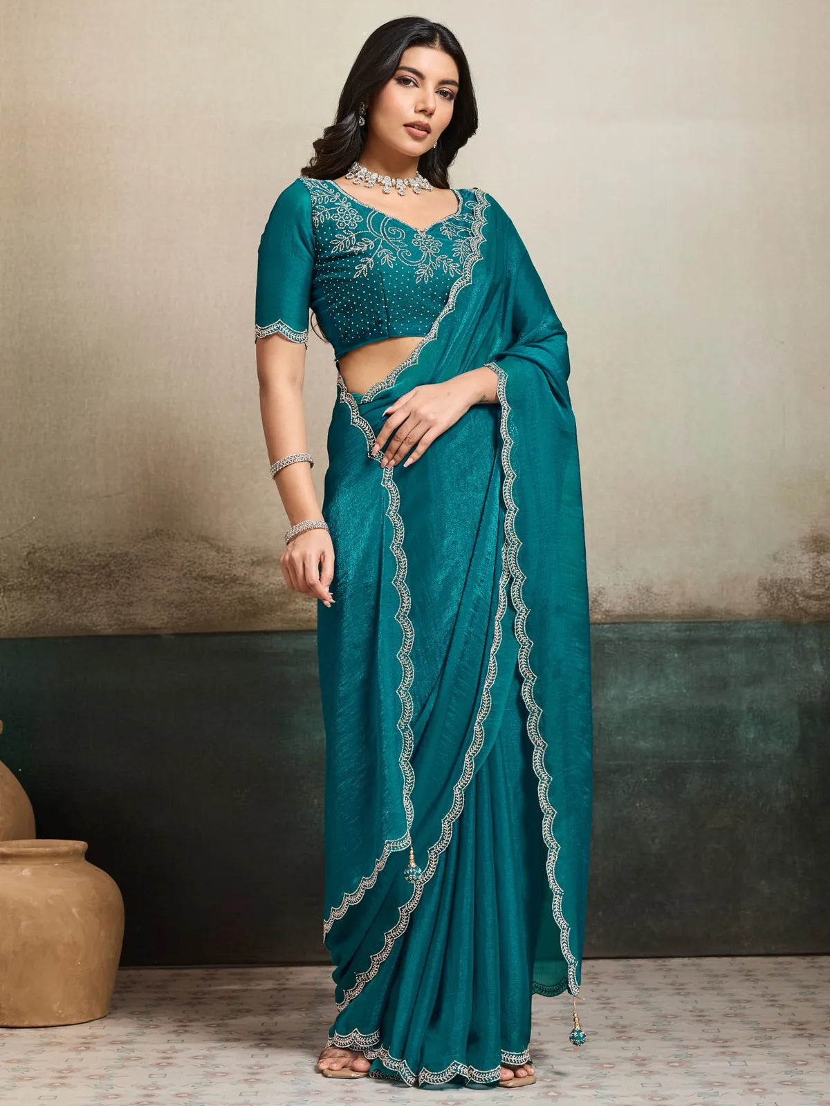 Tarani teal party wear saree with embellished border and designer blouse front pose