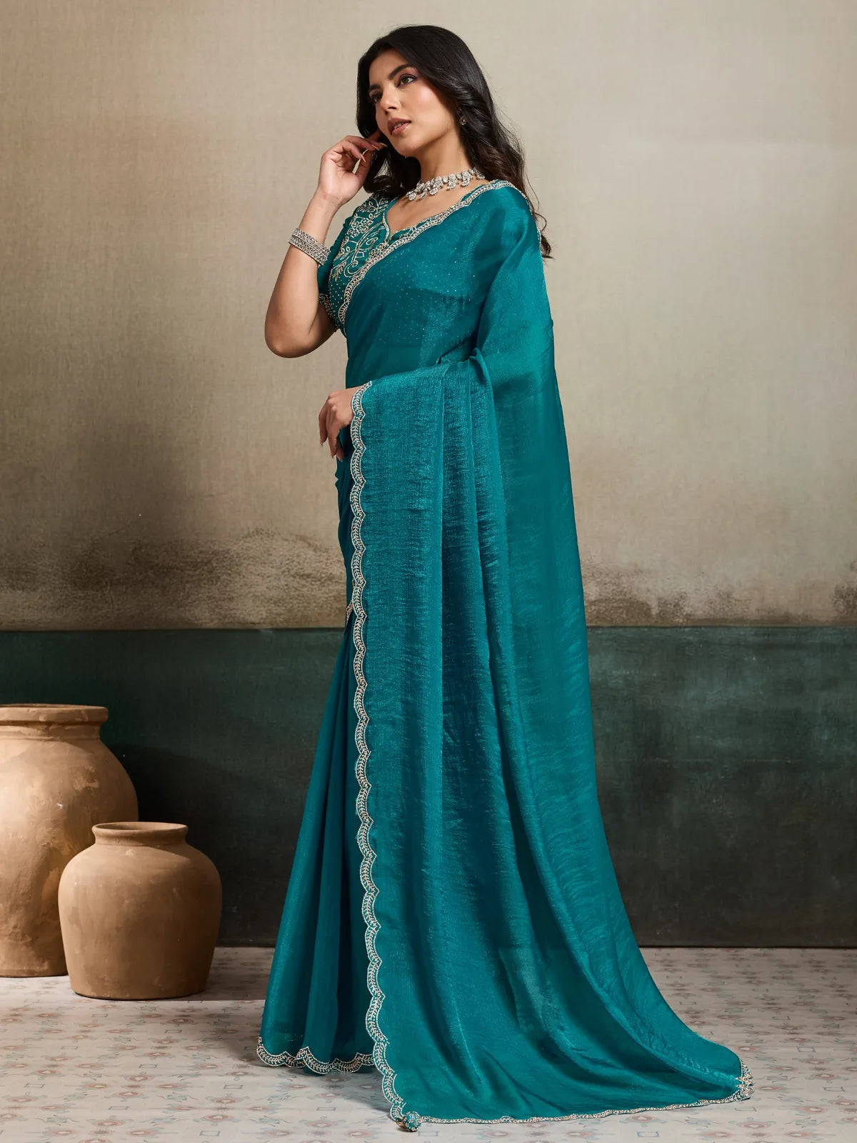 Tarani teal Fendy Chiffon Blooming saree side profile with decorative border work