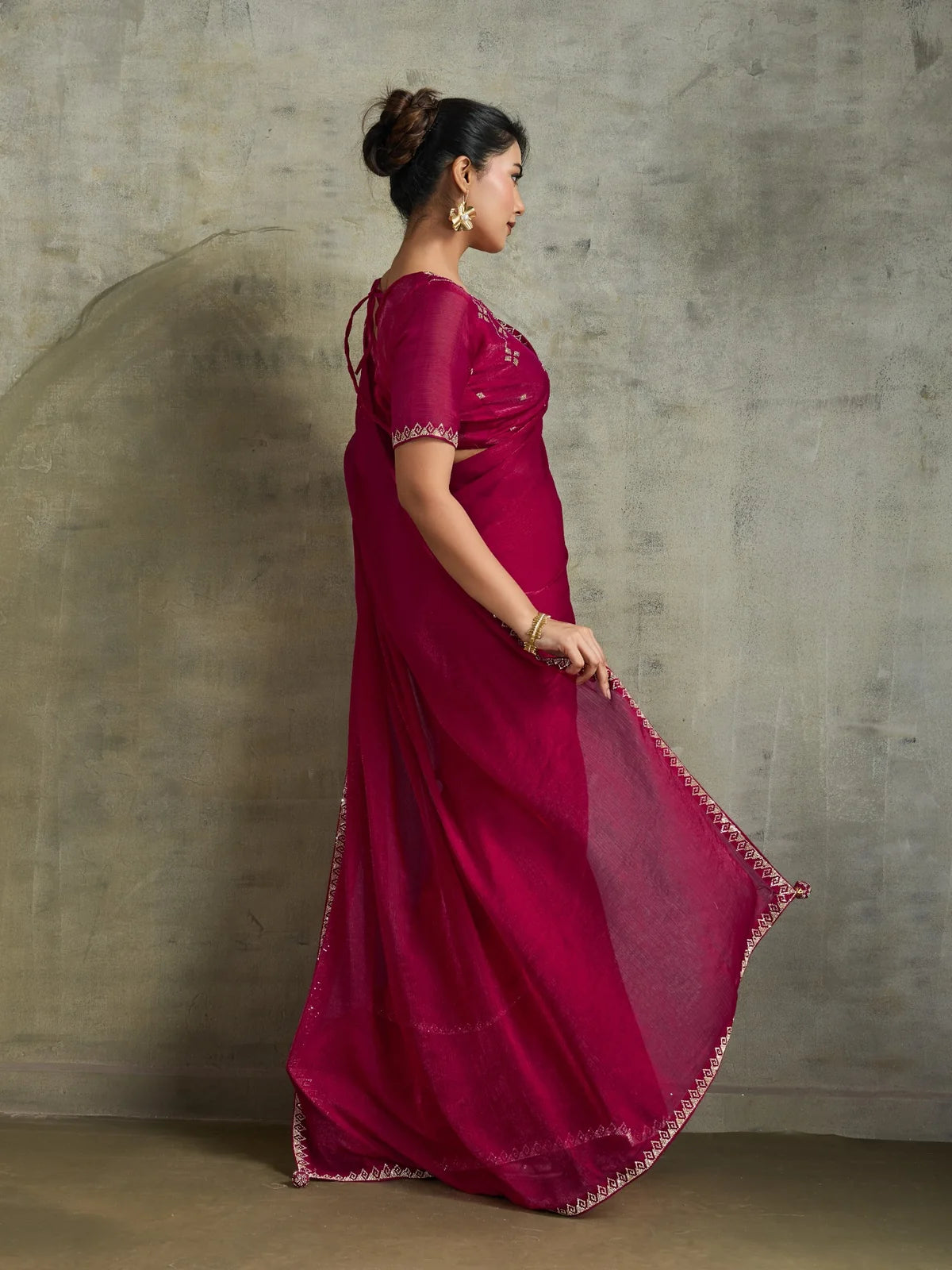 Tarani magenta chiffon saree back view with flowing pallu and embroidered blouse design