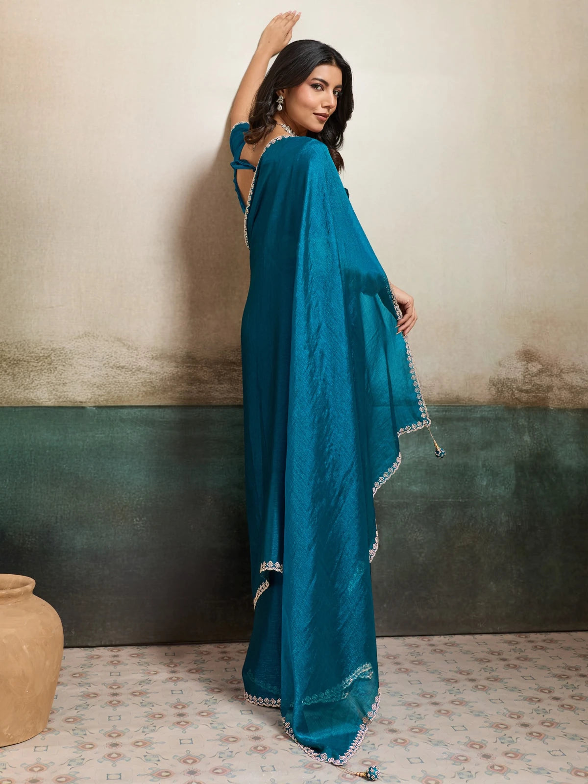 Tarani teal Fendy Chiffon blooming saree with Jarque work back view Neharika