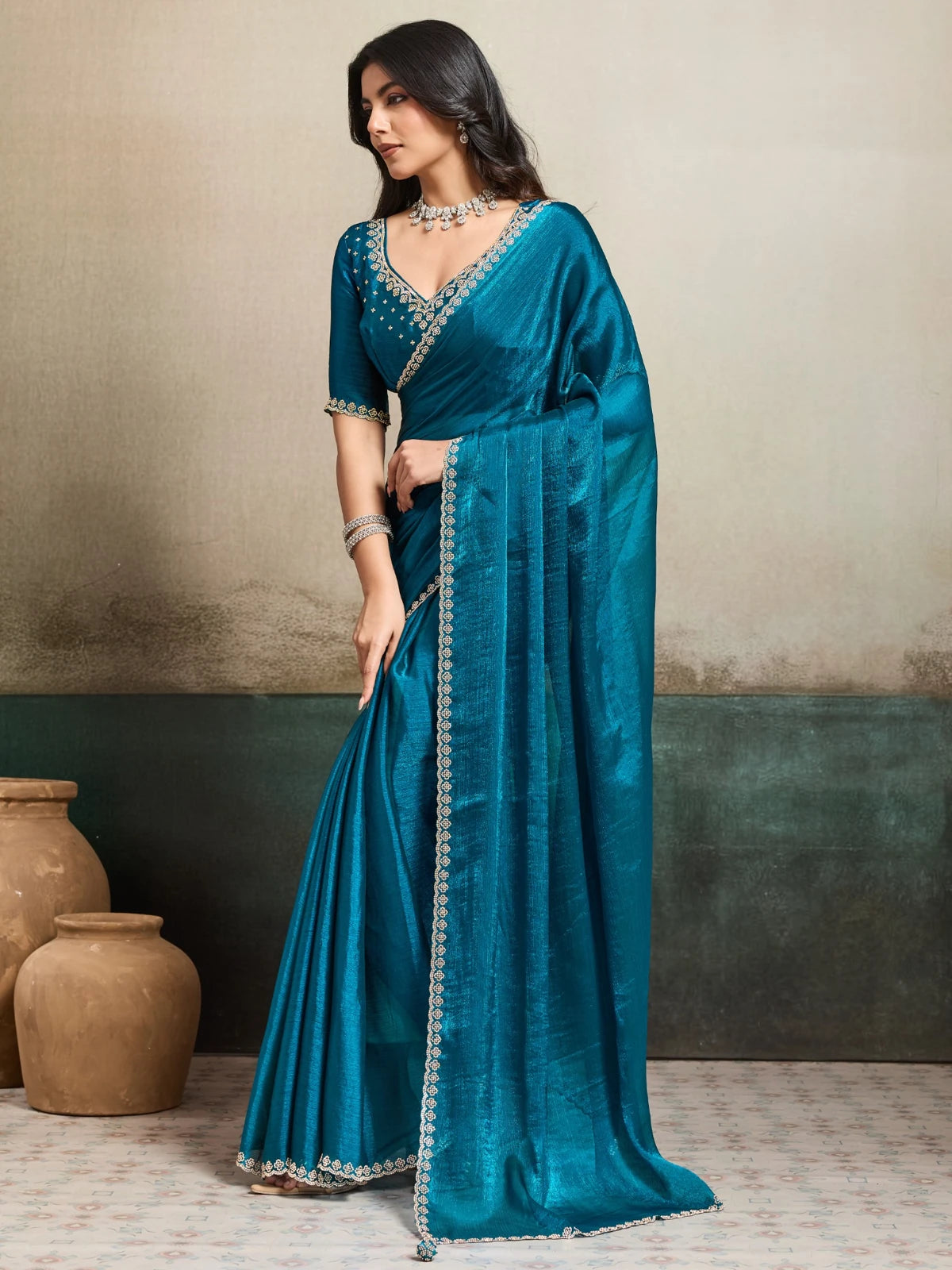 Tarani teal Fendy Chiffon blooming saree with Jarque work side view Neharika