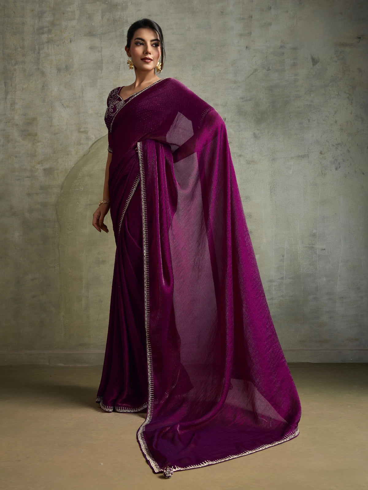 Tarani elegant wine party wear saree with flowing pallu and shimmer border detailing