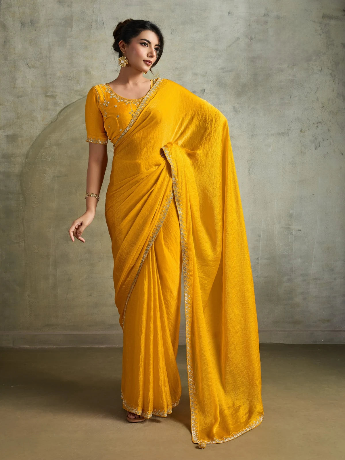 Tarani yellow Fendy Chiffon saree with designer Zarkan work full view for festive party wear