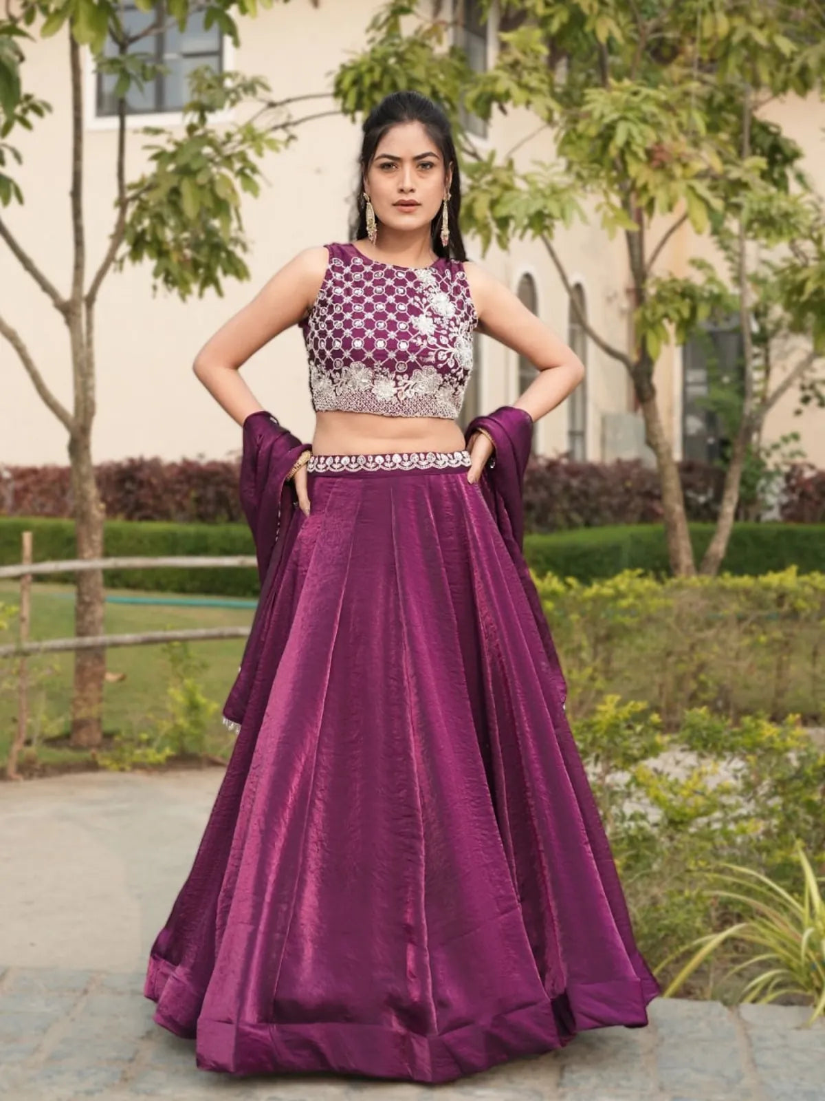 Tarani premium purple fendy lehenga with stitched flair and embroidered blouse, full front view in outdoor garden setting