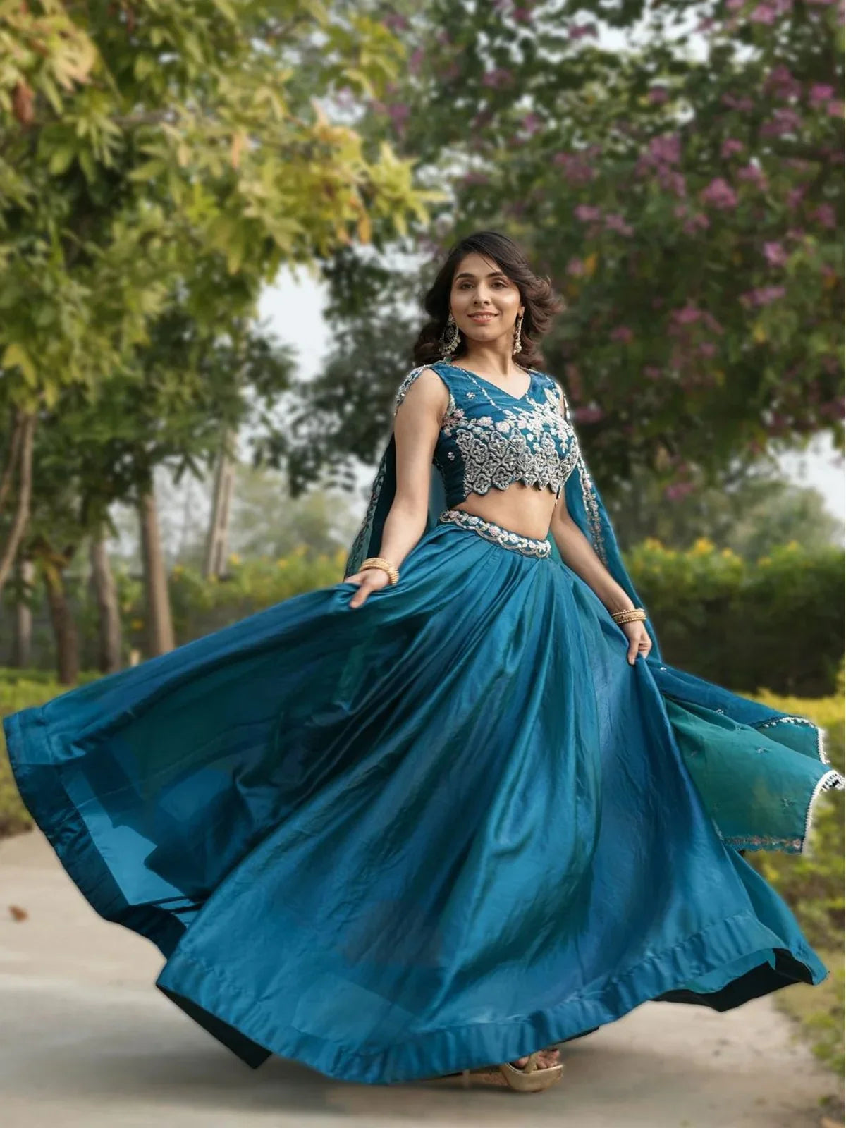Tarani front view of teal lehenga with full flair and elegant festive design for celebrations