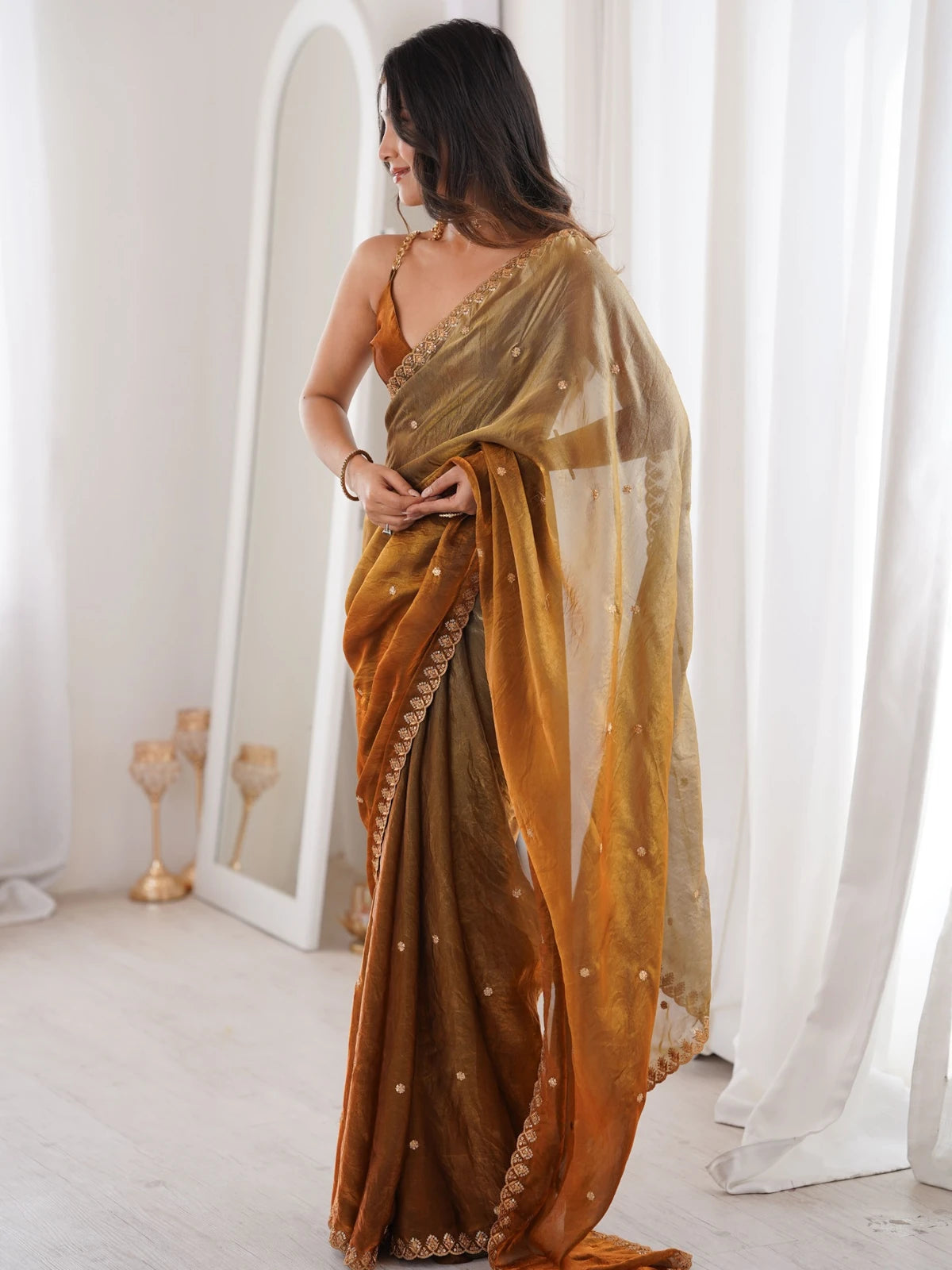 Tarani Aashi brown Fendy Satin wedding wear saree with flowing pallu side view