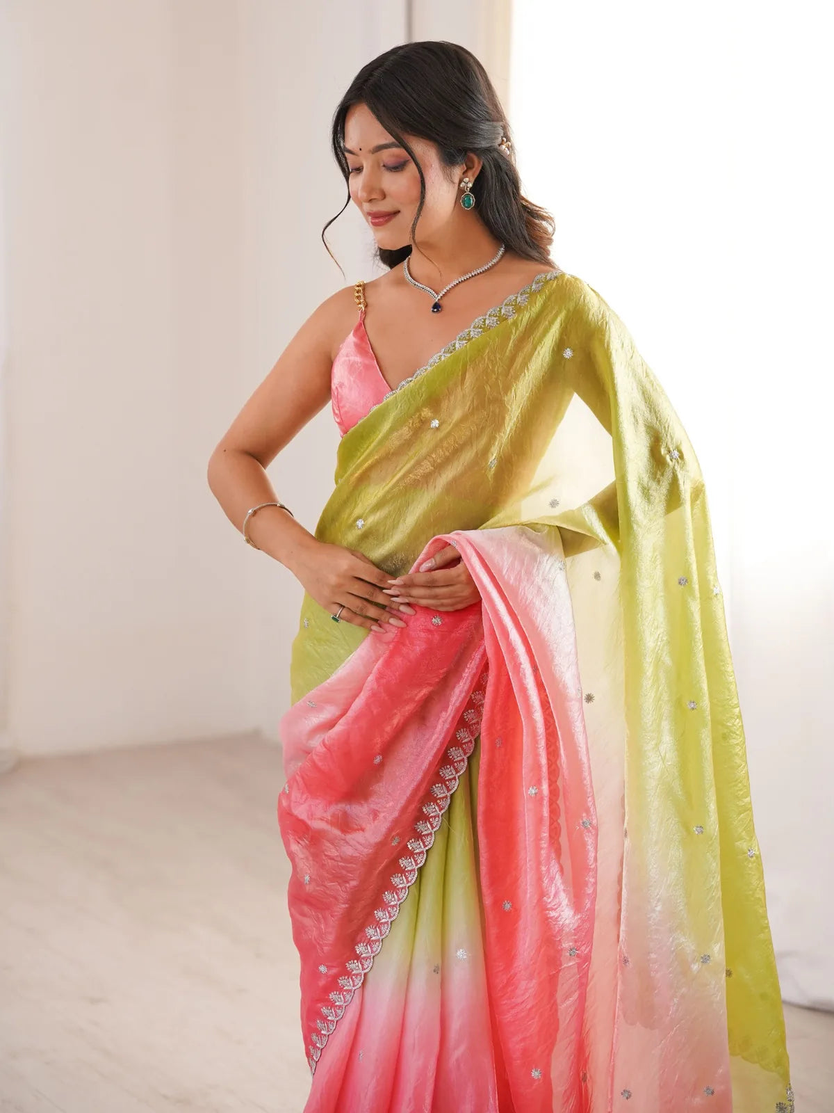 Tarani Pradnya green Fendy Satin saree upper body view showing embroidered border and blouse