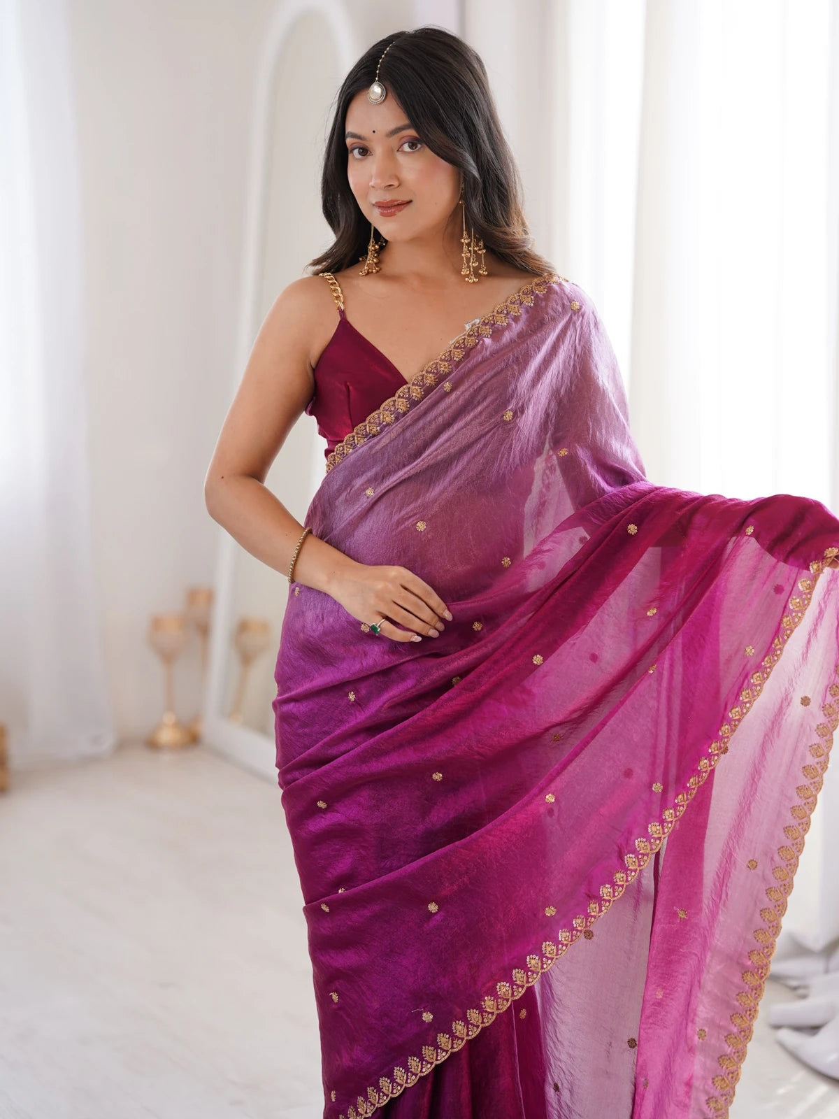 Tarani magenta Fendy Satin saree upper body view showcasing sequence embroidery border and blouse
