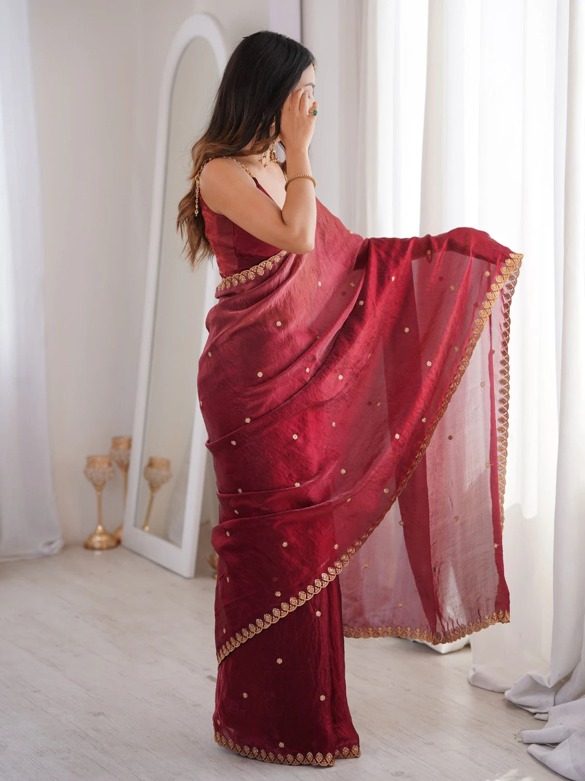 Tarani maroon Fendy Satin saree pallu view highlighting embroidered border and drape