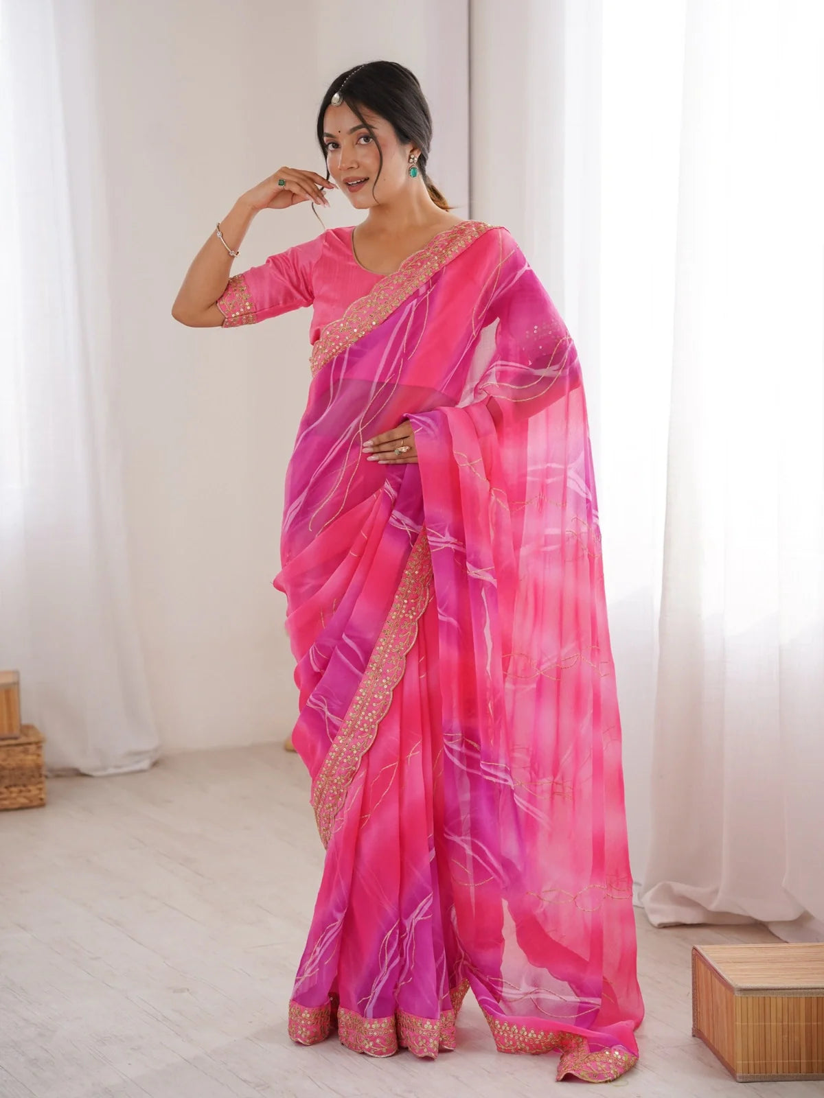 Tarani pink georgette chiffon saree with golden laheriya foil and sequins border full view