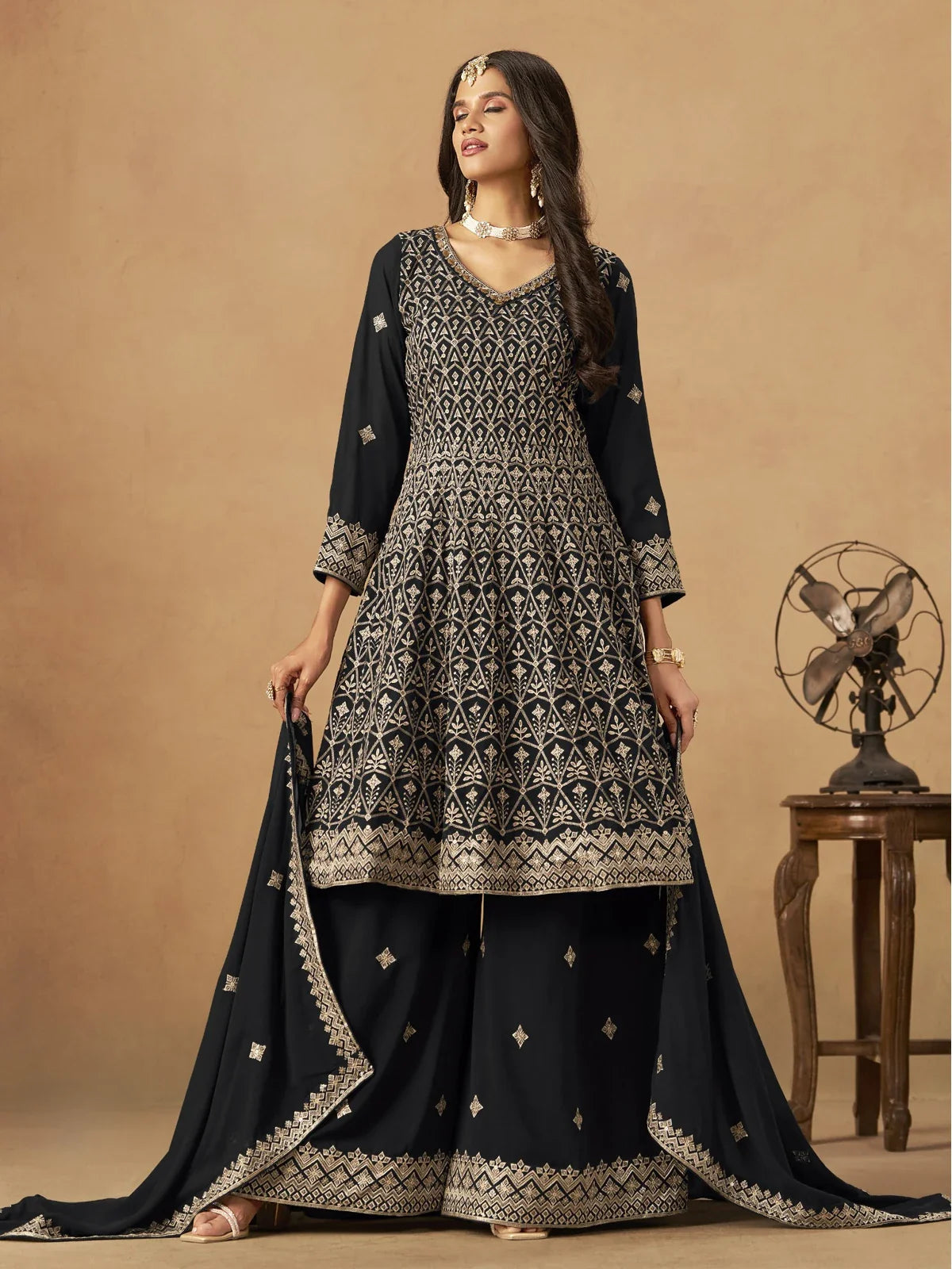 Tarani black georgette dress full view with golden embroidery dupatta and plazzo