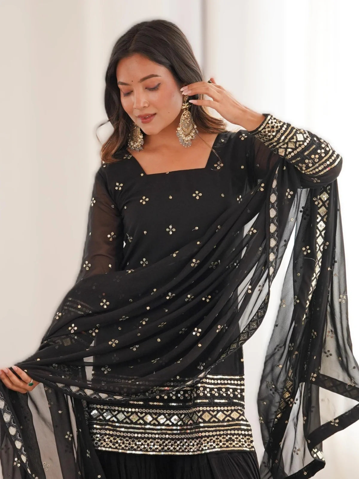 Tarani black georgette dress close-up showing neckline, sleeve embroidery and detailed dupatta