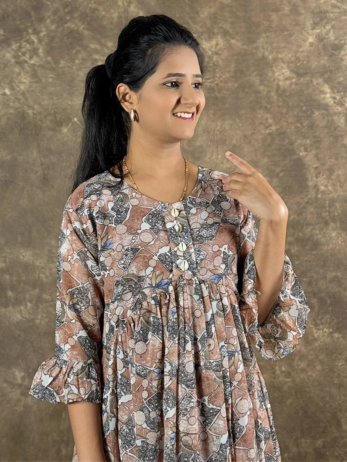 Tarani brown georgette midi dress upper body close look with round neck