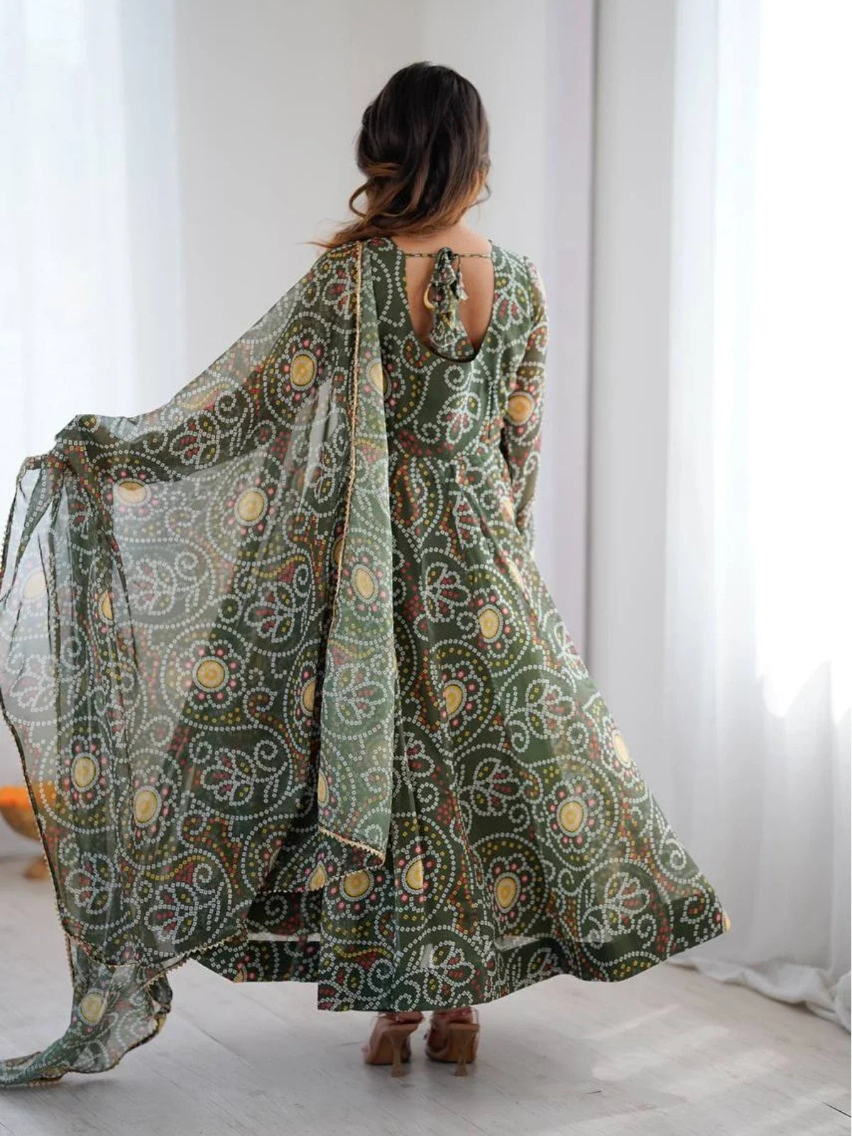 Back view of Tarani green georgette dress with keyhole and tied bow detail