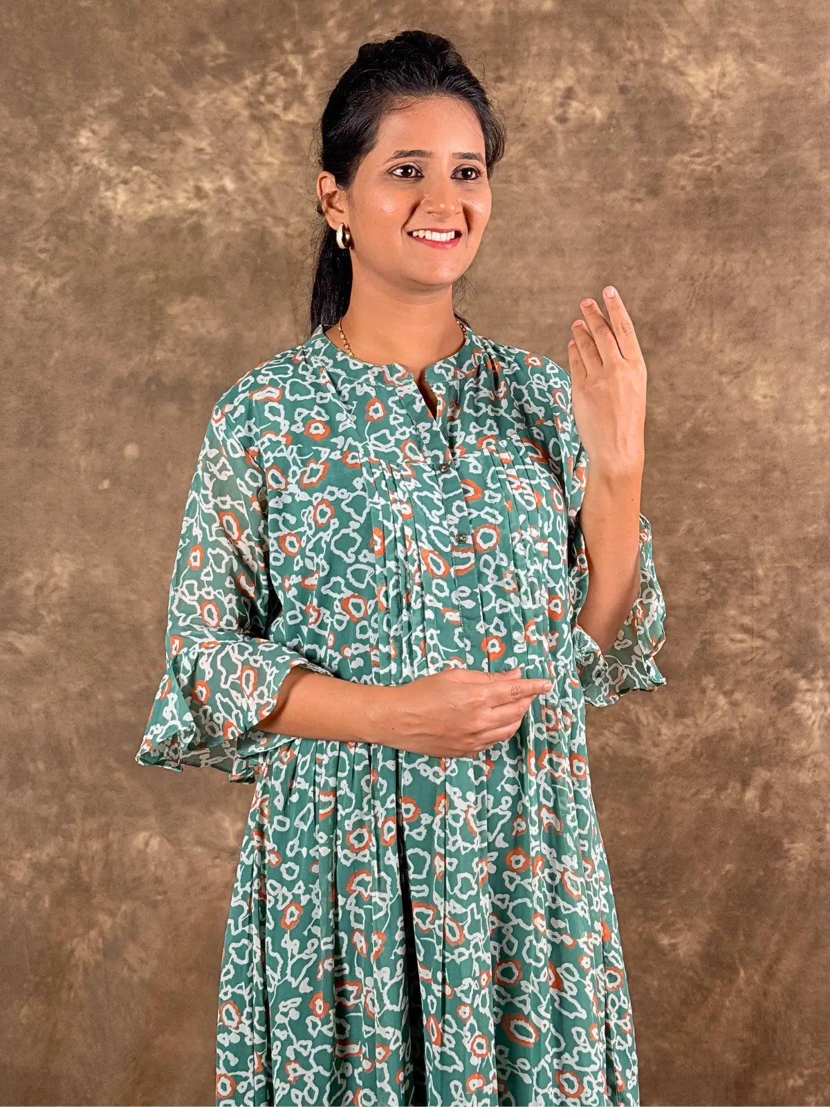 Tarani elegant green georgette midi dress front pose highlighting fit and flare style