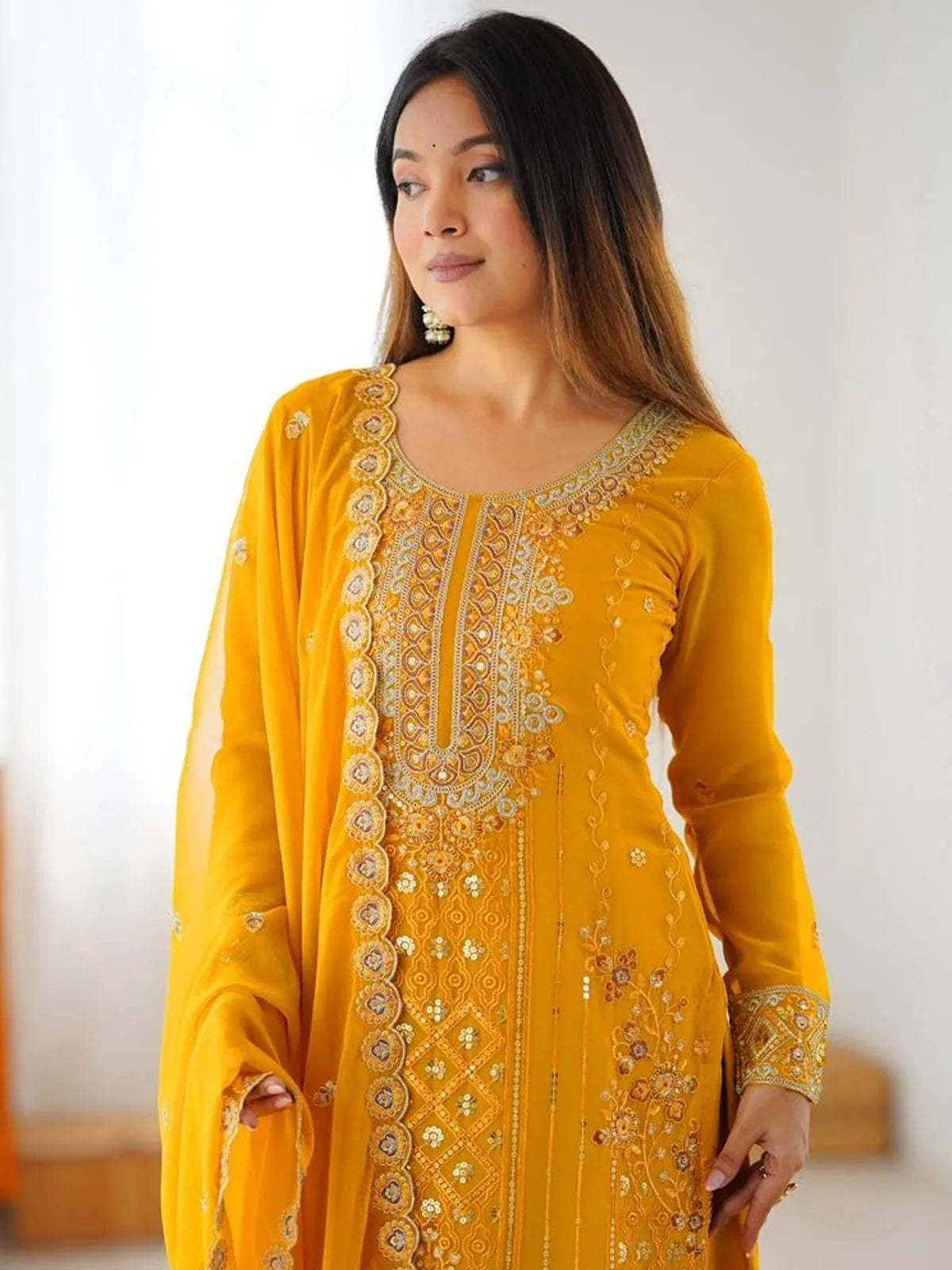 Tarani yellow georgette dress close-up with detailed zari and sequin work