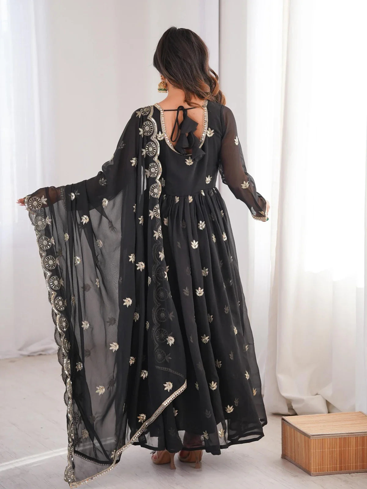Tarani black gown back design with tie-up bow and flowing dupatta