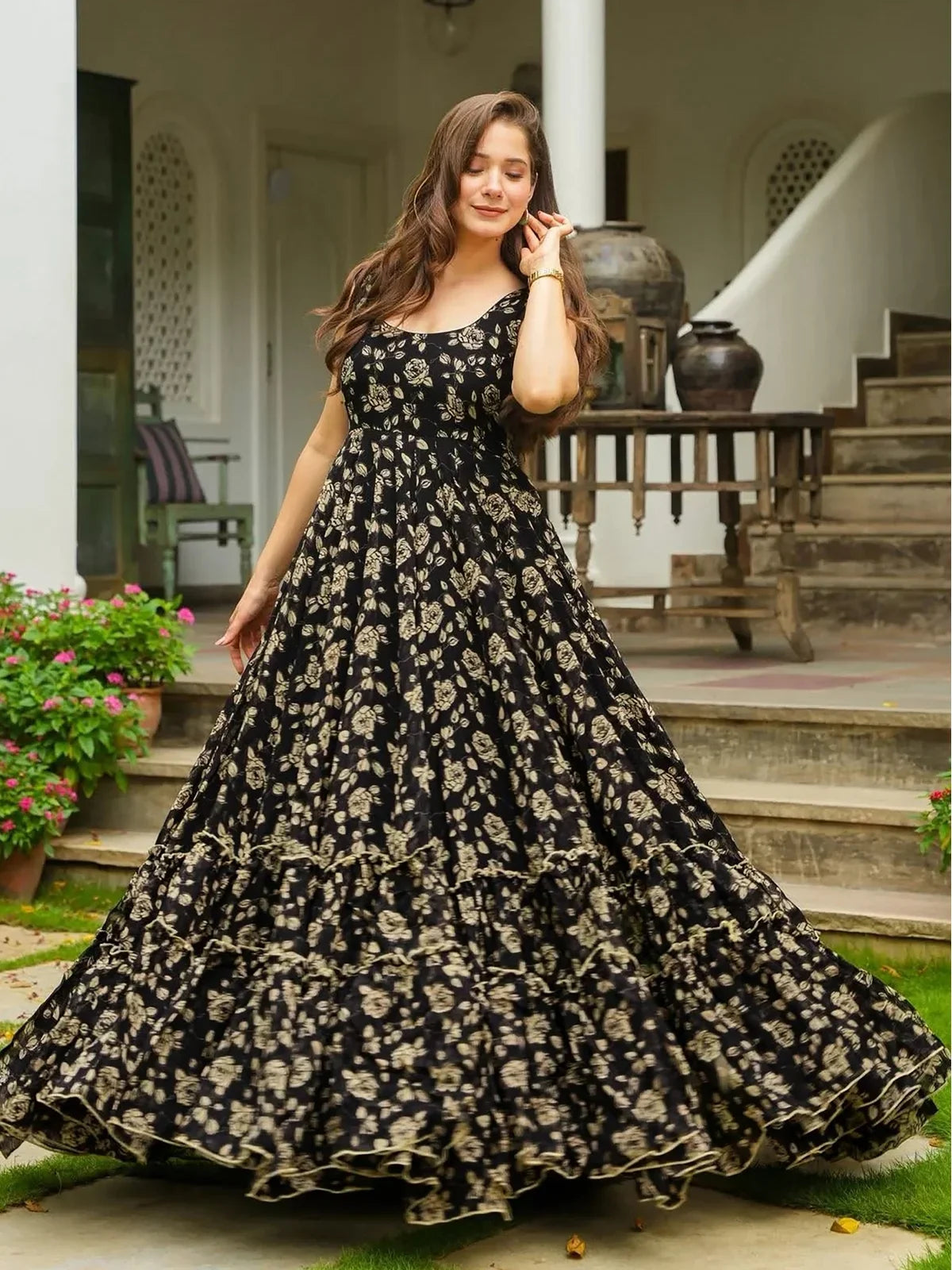 Tarani full flair digital floral gown in black georgette twirling view for parties and weddings