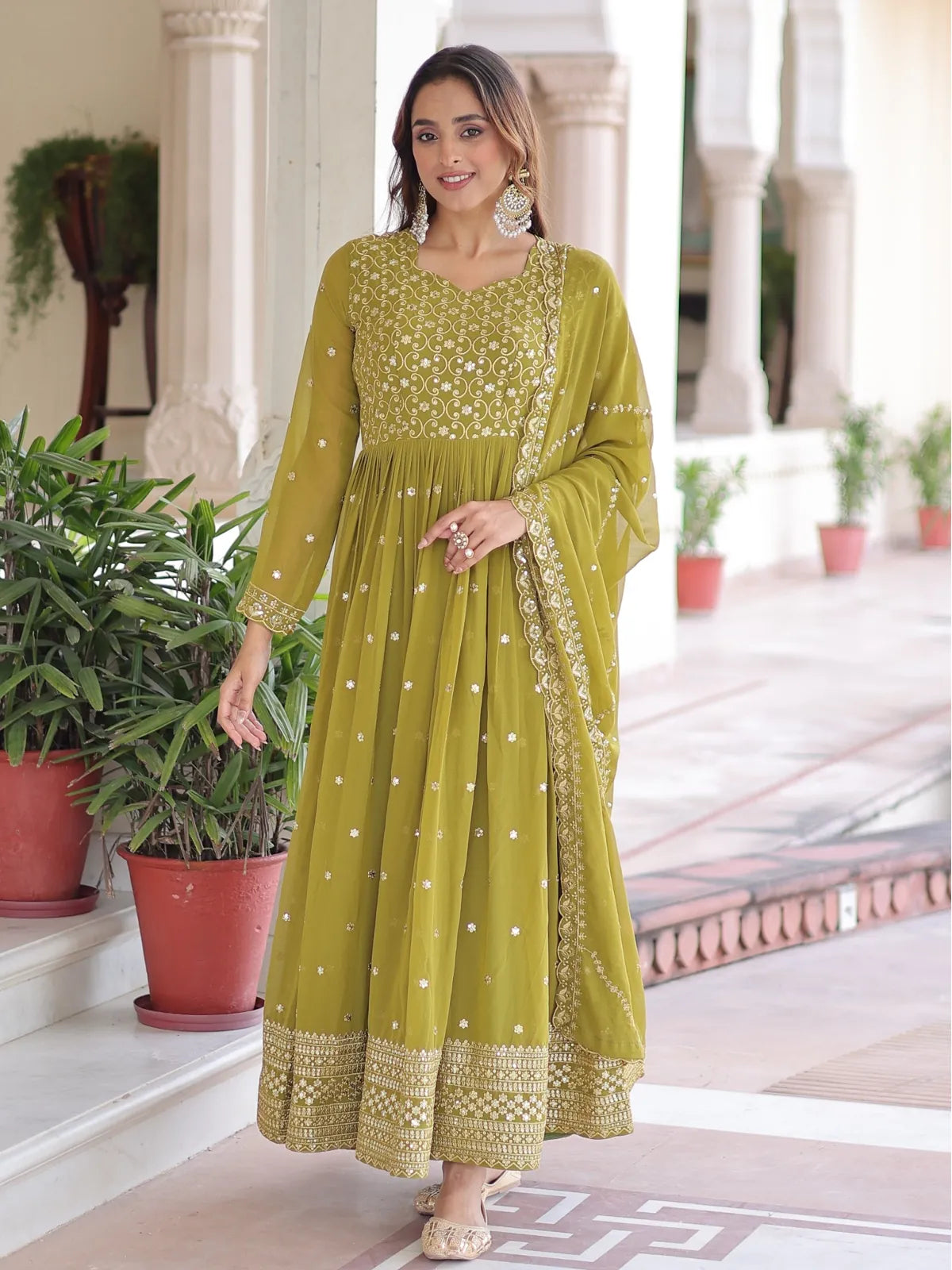 Tarani green embroidered faux georgette gown with full flare and sequins for festive occasions